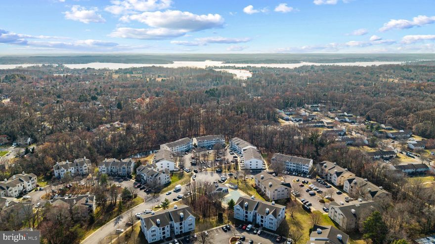 Take a look at this turn-key top-floor 2BR/2BA condo with soaring ceilings and beautiful natural light in Annapolis Overlook. This updated unit features all new flooring and fresh paint throughout, along with recessed lighting that enhances the bright, open feel. The kitchen offers granite countertops and stainless-steel appliances and flows seamlessly into the inviting living area with a cozy wood-burning fireplace. The spacious primary suite includes a walk-in closet and a private en-suite bath. Enjoy outdoor living on the private covered balcony. Additional highlights include a washer and dryer in the unit and ample storage. Residents of Annapolis Overlook enjoy community amenities including a pool and fitness center, all conveniently located just minutes from Downtown Annapolis, Quiet Waters Park, restaurants, shopping, and major commuter routes. Welcome Home!