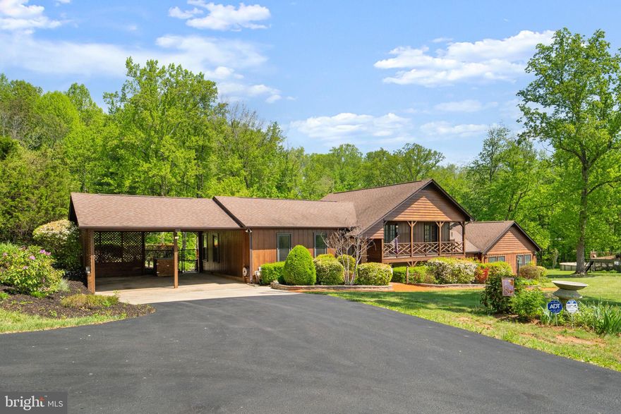 Welcome to 14945 Lee Highway, Amissville, VA—a beautifully maintained multi-level cedar-sided home set on 2 private acres surrounded by nature’s beauty. This property offers the perfect blend of charm, functionality, and modern updates.

Step inside to find natural hardwood floors and multiple living spaces designed for comfort and flexibility. Enjoy and relax in front of the fireplace, creating a warm and inviting atmosphere throughout the home.

The exterior is equally impressive with stamped concrete walkways, a fully fenced backyard, and a large driveway with a carport—ideal for entertaining or everyday convenience. A storage shed with a new metal roof and potbelly stove adds additional utility and character.

This home also features a separate in-law living area, offering excellent potential for multi-generational living or guest accommodations.

Major systems have been thoughtfully maintained and updated, including:
• Septic system in excellent condition
• Whole-house generator
• New gutters and downspouts
• Roof (2015)
• HVAC systems (2015–2010)
• Water heater (2021)
• Washer and dryer (2018)
• Stove and refrigerator (2026)

This is a rare opportunity to own a well-cared-for home with space, privacy, and versatility in a desirable Amissville location.
