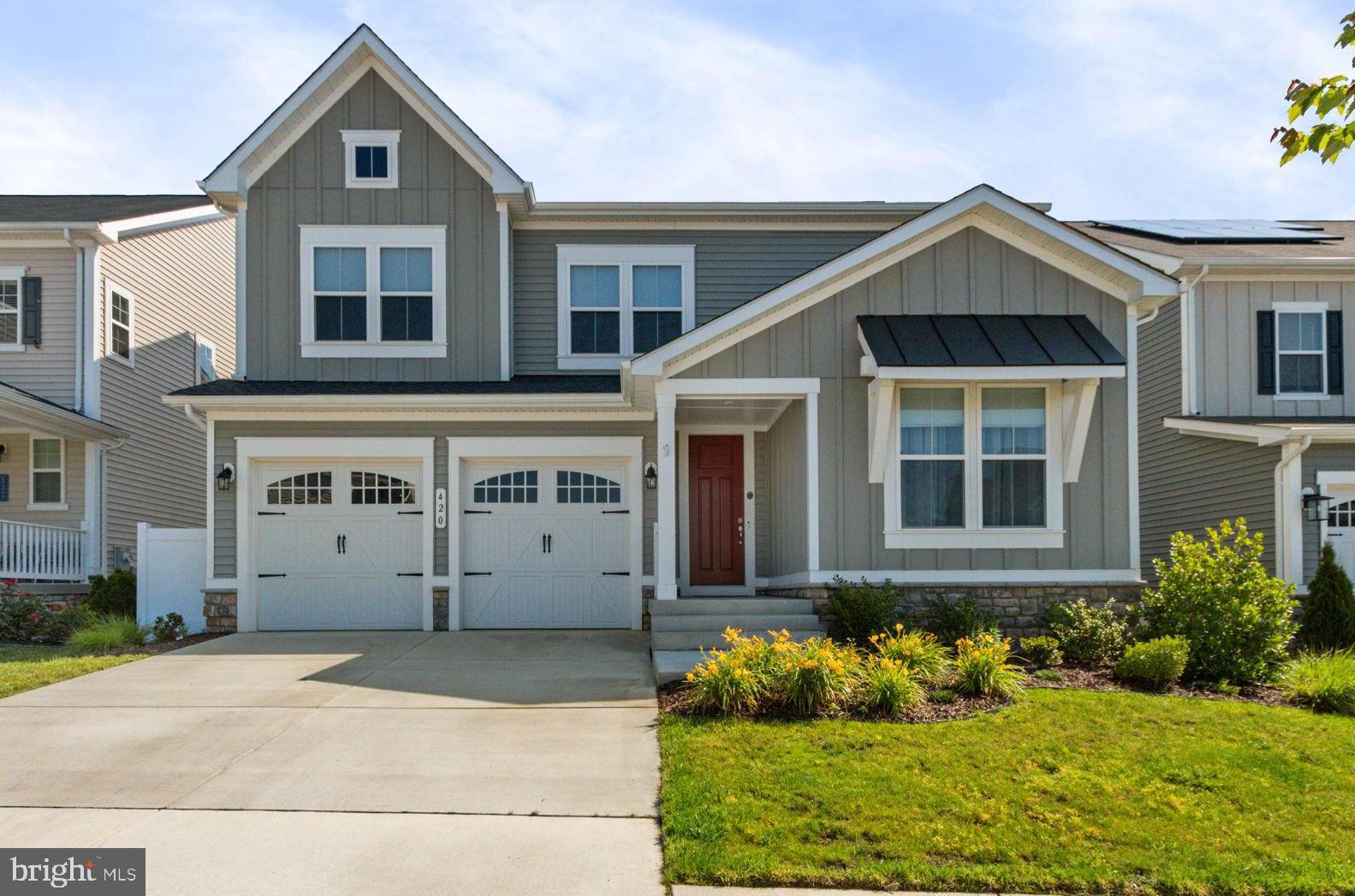 Welcome to 420 Smokebush Drive—where style, function, and location all come together in one of Stafford’s most vibrant communities. This beautiful home offers 3,781 finished square feet of thoughtfully designed space across three levels.
Step inside to a welcoming entry with 9-foot ceilings and durable LVP flooring that flows throughout the main level. A light-filled living room and private office with French doors provide flexible space for both entertaining and everyday life. The kitchen is a showstopper, featuring crisp white cabinetry, white quartz countertops, stainless steel appliances (including a gas range), a pantry, and an oversized island perfect for gathering. Just off the dining area, enjoy easy access to a low-maintenance composite deck—ideal for relaxing or dining al fresco.
Upstairs, a spacious loft-style family room offers a casual, airy retreat perfect for movie nights or quiet reading. The primary suite is a peaceful haven with a massive walk-in closet and spa-like bath featuring a soaking tub, dual vanity, and tiled walk-in shower. Two additional generously sized bedrooms share a well-appointed hall bath with a tub/shower combo.
The finished walk-out basement adds even more versatility with a large recreation room, a full bathroom, and a private fourth bedroom—perfect for guests, a home gym, or a hobby space.
Outside, the vinyl-fenced backyard has plenty of room for play, gardening, or simply relaxing in a hammock.
Located in sought-after Embrey Mill, enjoy access to an amenity-rich neighborhood with miles of trails, a community bistro, multiple parks and playgrounds, a pool, dog park, and more. Just minutes from Embrey Mill Town Center, major commuter routes, and all the best of Stafford living.