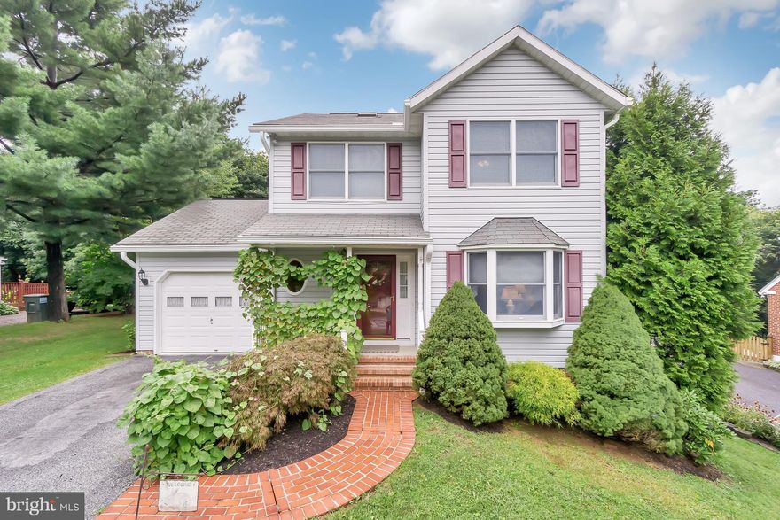 Beautiful and perfectly maintained. From the brick sidewalk to the trex deck this home is ready for you.  Amenities include 3 skylights, 7 ceiling fans, chair rail, crown molding & a moveable island in the kitchen. The main level family room has a cathedral ceiling and 2 sliding glass doors. The lower level is completely finished with a outside entrance. Just a short walk to the park & no city tax