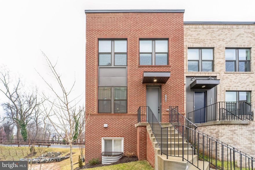 4% in incentives, up to $30,000, towards CLOSING COSTS and/or RATE BUYDOWN when using the seller-preferred lender and title company. Welcome to this beautifully maintained end-unit brick townhome, featuring 3 spacious bedrooms and 2.5 bathrooms. The main level boasts rich wood floors throughout, offering an open-concept design that seamlessly connects the living room, dining area, and kitchen. The kitchen is complete with sleek granite slab countertops, stainless steel appliances, a gas stove, and a central island perfect for meal prep and casual dining. Upstairs, you'll find 3 bedrooms, including the primary suite with its own private ensuite, complete with dual sinks for added convenience. The Laundry is conveniently located near the bedrooms! The lower level provides a versatile den, ideal for an office or additional living space, and offers direct access to the attached 2-car garage. Close to Union Craft Brewing, John Hopkins University, The Rotunda, and fine dining on the Avenue! Available for immediate occupancy! Call now to schedule your showing!