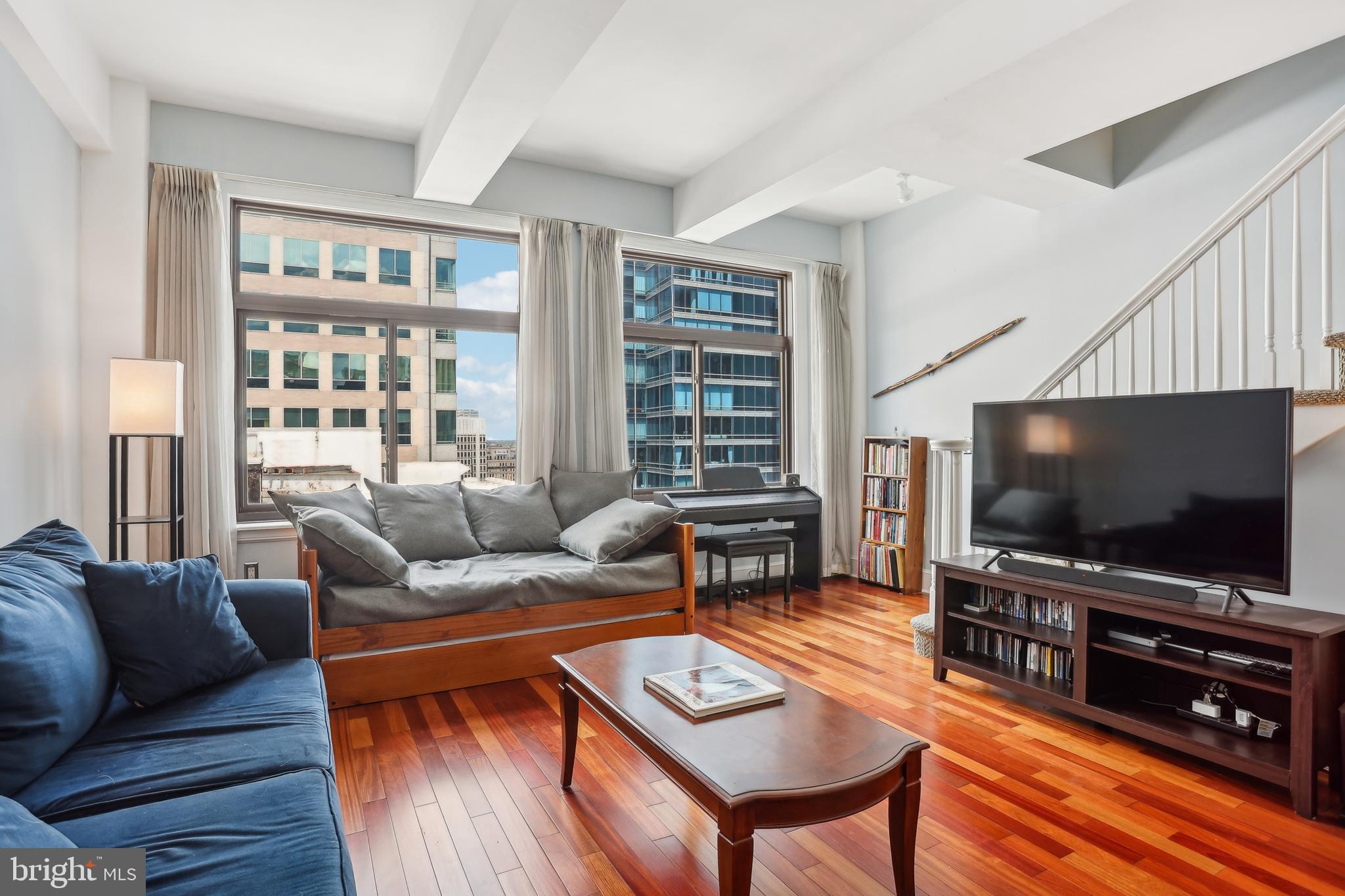 Welcome to #20H at the Ellington, a 1 bed + den bi-level PENTHOUSE located in the most coveted neighborhood of Philadelphia. Entering this unit, the main floor is an open-concept living space flooded with natural light from the oversized windows. This space easily accommodates a large sectional couch and dining set, and features high ceilings and cherry hardwood flooring. The classic kitchen includes granite countertops, KitchenAid stainless steel appliances, recessed lighting, and a breakfast bar with room for stool seating. Enjoy the convenience of two closets and a powder room with stacked washer and dryer on this level. Upstairs, find the additional den currently used as an office and for storage. The very spacious primary suite boasts ample space for a California king bed and plenty of room for furniture, and a skylight brings in additional natural light to illuminate the space. Walk through the area of three double closets to reach the ensuite bath, featuring a large tiled glass-enclosed shower with dual shower heads and a stone-top double vanity. The Ellington is a pet-friendly building that offers a fitness center, community room/lounge, and a 24-hour front desk receiving packages and deliveries. Residents also enjoy the convenience of keyless entry with a smartphone app and fob for secure and easy access. Electric heat and water is included in the condo fees. Storage lockers are available for a separate fee. Live in the very heart of Center City! Situated between Rittenhouse Square and Dilworth Park, this is a prime location with endless shopping and dining options, a vibrant nightlife scene, and dozens of cultural attractions to explore. 1500 Chestnut St is conveniently nearby public transportation including the PATCO Line and the Market-Frankford Line for quick access to 30th Street Station, Drexel, Penn, CHOP and HUP hospitals. Don’t miss this opportunity to live in the center of it all - schedule your showing today!