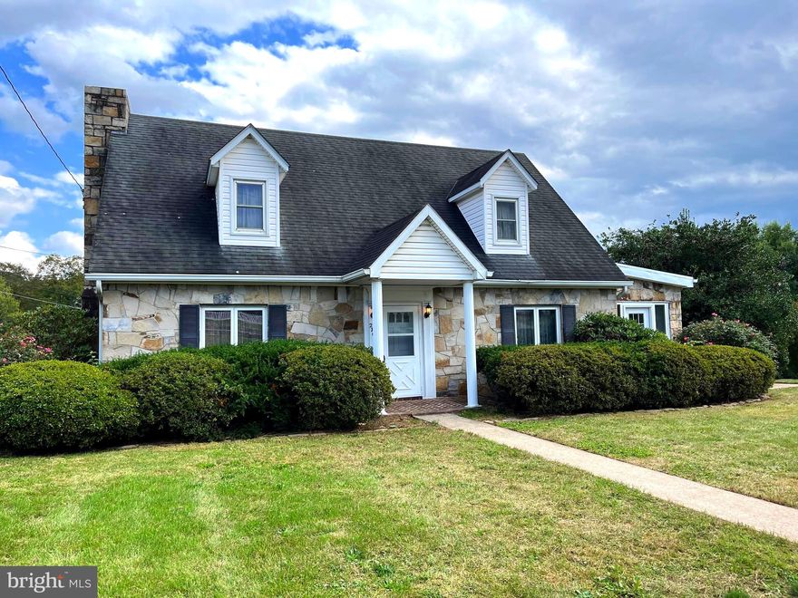 Back on market Monday! Step back in time in this wonderful stone cape cod home. You will fall in love when you walk in the door. This home offers large living room with stone fireplace and plenty of built ins. Large dining for the family and entertaining. Kitchen is great with built in bench seat, a bar area and still room for a table. Door to basement off kitchen. Stone sunroom with doors to front and rear yard. Upstairs 3 bedrooms and full bath. Downstairs kitchen/laundry area, storage room and a very large great room with half bath. Nice 2 car garage with roof top seating area. Lot size is 160x130. Estate sale...sold "AS IS". Easy commute to Martinsburg and Berkeley Springs, Trails to bike, Potomac River to fish. Call today for your private showing.