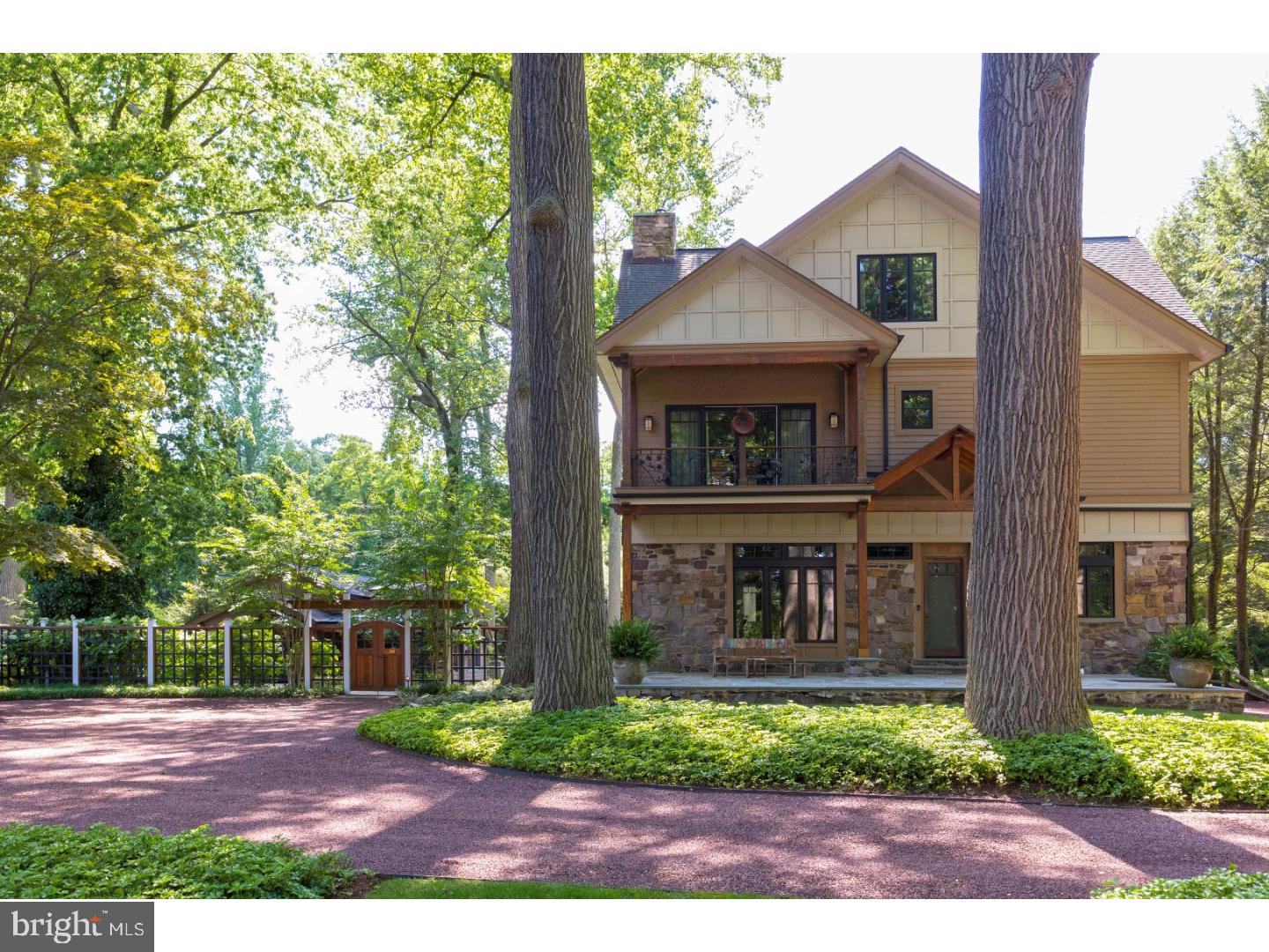 "Dual Waters" is a sophisticated and exciting fusion of both Modern and Arts & Crafts sensibilties. The home is located in the highly desirable North end of New Hope Borough. It is set back from the road, with custom IPE steps which lead up to the canal and tow path. One of the most exciting things about this property is the fact that it has expansive views of the Delaware river, with riparian rights, and a 50 foot terrace on the river with a dock suitable for two boats. The home was custom built 2006 incorporating an early 20th century stone fishing and hunting cottage. The stone walls of the house are original and were carefully restored. The property also includes an app 1,000sq ft cottage that was completely restored in 2007 as a two bedroom guest house with gas fireplace. There is a custom-built post and beam pool pavilion with IPE decking, refrigerator, outdoor shower, and private pool powder room. The salt water pool glistens against the wall of ever-green bamboo and 35 foot high Japanese temple fir trees. The main residence boasts one commonality...all of the rooms are generously sized with high ceilings. The main entertainment room contains Brazilian cherry hardwood floors (that run throughout the house), custom cherry ceiling beams, and a central fireplace that is the nucleus of the space. The adjacent open kitchen and dining area look out through a custom retracting wall of glass into a three season room. The kitchen offers a combination of honed quartz and glass counter tops, Subzero, Viking and Miele appliances service the kitchen that has a mid-century vibe. All windows and exterior doors are custom manufactured by Loewen. The family room is where the family gathers for T.V. and socializing. This room, like all of the public spaces, contain artistically crafted walls and millwork. The visual "wow" factor is the custom open staircase with metal railings that traverse three levels. The second level contains two guest bedrooms and two full baths, as well as a master suite with a full bath and two walk in closets. The master bedroom balcony that fronts the River, is wrapped in a custom designed wrought iron railing that depicts vignettes of River. The large master bath has a two sink vanity, 2 head rain shower and an oversized tub that looks out to the Delaware River. The irrigated grounds are meticulous and the bluestone hardscaping throughout is visually impressive."Dual Waters" is one of those rare properties that captures your imagination.