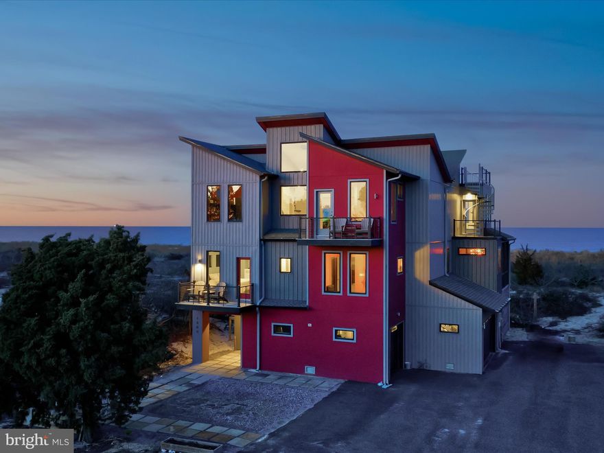 Welcome to your dream retreat nestled in the exclusive gated community of Back Bay Cove! Inspired by the iconic architecture of Frank Lloyd Wright, this stunning bay front home seamlessly blends contemporary luxury with the tranquility of its natural surroundings.  Built in 2019, this 5 bedroom, 3 ½ bath home has everything you need to enjoy the natural habitat at your doorstep, entertaining family and friends, and indulging yourself in relaxation.
Step inside to discover an open floor plan that effortlessly connects the living, dining, and kitchen areas, creating a spacious yet inviting atmosphere perfect for entertaining or simply unwinding with loved ones. Cozy nooks and intimate spaces throughout the home provide the perfect spots for relaxation, while large windows frame breathtaking views of the Delaware Bay and Prime Hook National Refuge.
Ready for immediate occupancy, most rooms come furnished, allowing you to effortlessly settle in and personalize your space. Spend your days soaking up the sun on the beach or gathering around the firepit in the evenings.

The center of the action occurs in the graciously sized living room with a large 100" electric fireplace (plumbed for gas) that opens out onto another stunning bay front deck. The gourmet kitchen is outfitted with propane cooktop, convection oven/ microwave, and expansive kitchen island.  Directly next to the kitchen is the sunrise sitting area, featuring additional beautiful bay views.

Retreat to the luxurious master bedroom boasting a 50’’ horizontal fireplace and a spacious walk-through closet leading to the spa-like bath. Indulge in relaxation with a slipper air-jetted tub, a four-head shower, and radiant heated floors.

A highlight of this property is the unique Mod Pool, featuring a versatile design that combines a year-round pool and hot tub, complete with a removable wall and a beach-facing window for unparalleled views.

Take full advantage of outdoor living with multiple decks and balconies, including a rooftop deck where you can soak in panoramic vistas of the bay and surrounding landscape. Just a short stroll away lies your own private beach, where you can indulge in sunbathing, kayaking, paddle-boarding, or leisurely walks with your furry friend.  Entertain guests on the main deck equipped with piped-in gas for the grill and fireplace, both of which are included with the home. Perfect for relaxed gatherings or al fresco dining with ocean breezes.

After a day at the beach or an evening by the firepit, rinse off in the outdoor shower conveniently located near the beach and firepit area. Plus, plumbing is already set up for easy installation of a full outdoor bath.

While an elevator is not currently installed, the infrastructure is in place for future convenience. Stay active with the option to use the stairs or add an elevator whenever you desire.

This is not your ordinary beach house – it's a sanctuary of style and sophistication, offering the ultimate coastal living experience. Don't miss your chance to make this extraordinary property your own!