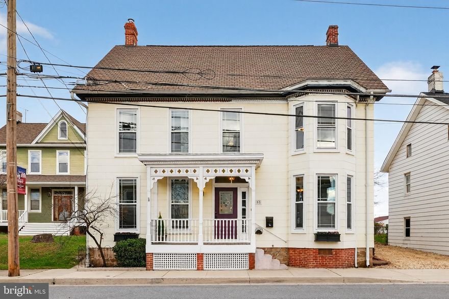 The Historic Shildt House (c.1892) – Timeless Victorian Elegance in Taneytown. Step into a piece of Taneytown history with the Historic Shildt House, originally home to the town’s blacksmith, James Shildt -  whose craftsmanship and legacy still echo through this remarkable property. This late-Victorian treasure showcases classic architectural details, including a graceful turret, front porch, and ornate millwork that speak to the artistry of its era. Inside, you’ll find 4 spacious bedrooms, 9-foot ceilings, and a thoughtful floor plan featuring dual staircases and two fireplaces, blending historic character with modern comfort. The primary suite offers a private bath, while the spacious kitchen impresses with stainless steel appliances and abundant cabinetry and butler pantry — the perfect gathering place for family and friends. Throughout the home, original wood floors and replacement windows create a seamless balance between preservation and practicality. Outdoors, the charm continues with a fenced, landscaped backyard featuring tiered gardens, a two-story barn, and a beautifully restored two-story summer kitchen — now converted into an office or creative studio, complete with a fireplace. Located in the heart of the Taneytown Historic District, the Shildt House is more than a home — it’s a living piece of Maryland’s history, lovingly maintained and ready for its next chapter.
