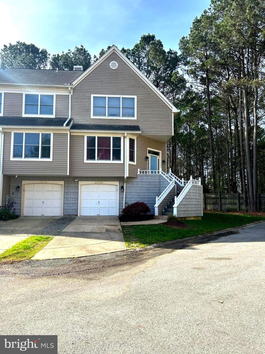 Now is your opportunity to own a terrific end unit townhome in sought after Breton Bay community.  This community is typically characterized  as a safe and secure environment, boasting high-quality schools, great local retail & convenient restaurants. As well as access to amenities including waterfront activities,  the local beach, golf course and tennis courts, playgrounds and strong sense of community.  In this thriving economy of Saint Mary's County this neighborhood  provides its residents with a high quality of life and a sense of belonging: the only thing missing is you.  You'll find yourself at home adoring not one but two primary suites on the upper level of this home.   The third bedroom in the lowest level could actually provide a versatile space for a variety of activities. Here are a few examples of how this space could be used:
An extra bedroom for guests or family members
A home office or study area
A playroom for children
A workout room or home gym
A theatre room 
One of the benefits of having a multi-purpose room is that it can adapt to your changing needs over time. As your family grows or your lifestyle evolves, you can easily modify the space to fit your new requirements. 
Additionally, since the basement is at ground level, it may offer some natural light and ventilation that can make the space feel more inviting and comfortable. Amongst this lower level finished space you will also be greeted with a full bathroom, a private and spacious closet, access to the ground level garage, and an impressive place for your additional storage needs.  
The main level of this townhome provides the primary entertainment and relaxation space. Enjoy the cozy gas fireplace in the living room, or host a large holiday meal and utilize both the dining area AND the eat in Kitchen space. The large deck; accessible from the main floor, is awaiting your personal touch of outdoor furniture, plants and lighting to enhance the ambiance. 
Come see this home today and see how far your pride of ownership will skyrocket once you personalize this living space. Build equity in a community that only continues to establish a stable foundation for home owners.