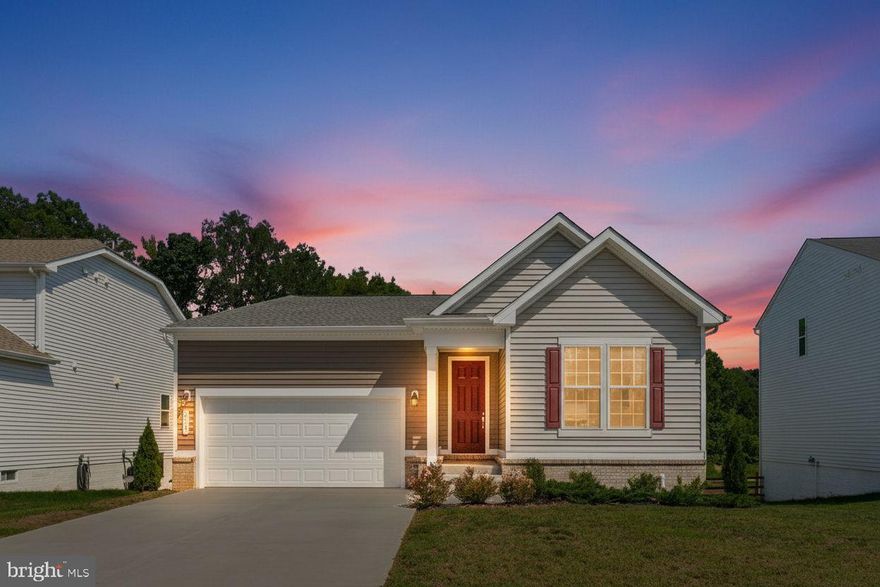 NEW PRICE! BRING US AN OFFER! Water Access Community! Beautiful Alexandrite Model with Main Level Living w/4 Bedrooms, 3 Baths!  Built in 2024 this Home Boasts a Gourmet Kitchen w/Quartz Countertops, Stainless Appliances, and Island w/Seating for 4!  Open Floor Plan, perfect for Entertaining with Dining Area, Family Room, Electric Fireplace and Sliding Doors to Back Deck overlooking the Backyard and Woods. Primary Suite with Large Walk-in Closet, Primary Bath with Quartz Dual Vanity and Walk-in Shower.  ***** Need More Space? The Lower Level features a HUGE Rec Room with Wet Bar, Plug located in Ceiling for a Future Movie Night Projector, Full Bath with Tub/Shower, and a Spacious 4th Bedroom!  Walk out to a Fenced Backyard perfect for Children and Pets. *****  The 2 Car Garage Features an Electric Car Charging Plug, Generator Plug, and Wall & Ceiling Storage  ***** The Community Amenities are FANTASTIC!  Community Boat Ramp and Dock on the Rappahannock River for Fishing, Kayaking, Motorized Boats and the Views are just Beautiful!  The Community Center features a Swimming Pool, Tot Lot and Playground, Tennis Courts, Basketball and More! ***** Perfect Commuter Location just off Route 3 with Easy Access to I-95 & Route 301 near Dahlgren Naval Base, Patuxent River Naval Air Station, several VRE stations and US 301 Bridge.