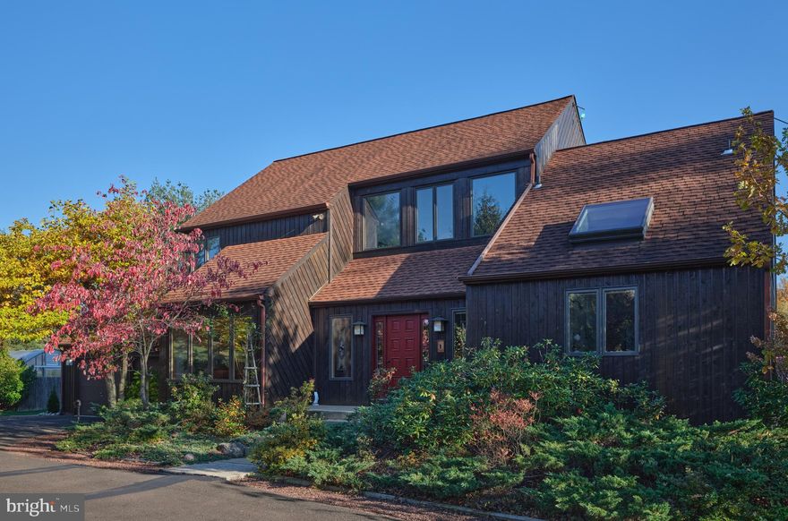 SECLUDED COMFORT, SUSTAINABLE SOPHISTICATION
4 Bedrooms | 3.5 Bathrooms | 5+Acres | Solar| Geothermal Energy. 
Tucked at the end of a long driveway, on over five pristine acres, the house stands as a masterclass in modernist contemporary architecture, updated for a future that demands intelligence alongside style. This Custom-built residence is thoughtfully designed for both intimate gatherings and grand entertainment. The kitchen, expansive great room and dining area easily accommodate a crowd. The Sun filled great room brings the outside in and is equipped with propane stove.  The first-floor primary suite is a peaceful retreat with a spacious, light-filled bedroom and an ensuite bath with summer shower and winter shower/steamer. A soft, neutral palette establishes a sense of openness and harmony across the living, dining and kitchen areas. Panoramic views expand to 360 degrees from every window. Conveniently, from the kitchen and great room , there is access to a generous deck where you can watch the sunrise over your acreage,and is also  ideal for outdoor dining. Stone steps  lead down to a large bluestone patio and secluded pool with spa. The large eat-in kitchen features stainless steel appliances, spacious countertops and abundant cabinetry, delivering both timeless elegance and modern functionality. An airy loft above the great room provides flexible space and leads to three additional bedrooms and a shared bathroom.  The fully finished lower level features an expansive rec room, an exercise room, private office/gaming room , generous closets and a full bath. An additional heat source is provided by a pellet stove.   Engineered for energy efficiency and comfort, this residence utilizes this state-of-the-art geothermal system that leverages the earth’s consistent underground temperature for both heating and cooling, significantly reducing utility costs and environmental impact. The integrated solar panel array is designed to meet virtually all of the home's electrical demand, feeding surplus energy back to the grid and further lowering the carbon footprint. High-performance Pella Design Series windows ensure year-round thermal stability and quiet interiors. Read oak wood floors are throughout. . Additional features include a whole-house UV water filtration system. 
There is an attached two car garage with ample loft space for all your storage needs. A dedicated level 2  EV charger is conveniently located in the garage. 
The Grounds consist of five plus acres and offer a diverse landscape of manicured lawn and  native wildflower meadows. An array of dogwoods, maples, fruit and nut trees as well as ornamental grasses completes the picture. The Pool and spa area is surrounded by manicured landscape, providing privacy. Additional outdoor features include a Greenhouse, set in fenced garden, a large workshop, tractor shed,  bike shed and lean to. Set back significantly from the road, the property provides seclusion while remaining minutes from New Hope and Doylestown. Located within the esteemed New Hope-Solebury School district. Just 70 minutes to New York City, one hour to Philadelphia and 35 minutes to Princeton. This is more than a home; it is a signature property designed for sustainability, comfort and efficiency.