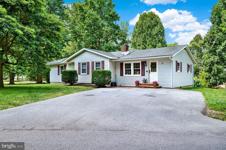 Welcome to 51 Packett Drive! This home is in the desirable Tuscawilla Hills community, located just outside of historic Charles Town in Jefferson County, WV. This 4-bed, 2-bath ranch-style home has had many recent renovations, making this home move-in ready! There is an interior room currently used as a kid's playroom that could be used as a 5th bedroom if additional sleeping space is needed. Recent improvements to the kitchen include a complete makeover of the layout,  new tile floors, a butcher block style island countertop, backsplash, and a pantry has been added. The kitchen sink features instant hot water, a water filtration system, and a garbage disposal. Other improvements to the home include new carpet, fresh paint, and new trim. The primary bedroom offers tray ceilings, crown moulding, and French doors that lead to the rear deck. A closet has also recently been added to this space. The basement remains unfinished, allowing future owners to finish it to their needs if desired, or it can be left unfinished and used as excellent storage space. Locust Hill Golf Course is directly behind the property, meaning you can walk to your tee time! Neighborhood amenities include playgrounds, a basketball court, a soccer field, and common areas. Schedule your showing today to see what this great home and community have to offer!