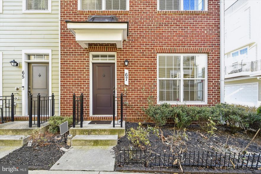 This bright and sunny four-story end-unit townhouse is located in the heart of Towson within the Towson Green community. Tucked away from traffic, this newly built, energy-efficient home is one of the largest models in the community, featuring an attached 2-car garage, two decks, and top-floor city views. The townhouse boasts 3 bedrooms on the first upper level, with an additional room on the entry level floor that can be used as a bedroom, playroom, office, or gym, making it effectively a 4-bedroom home. The main level offers an open floor plan with gleaming hardwood floors and crown molding throughout the ceiling. The top floor features an additional family living room with an attached half bathroom and an adjacent roof balcony with oversized glass doors to enjoy the beautiful city views. The community offers a private playground and a rain garden. Conveniently located within walking distance to Whole Foods, Starbucks, the movie theater, restaurants, shops, the Towson Town Mall, Towson University, and much more!