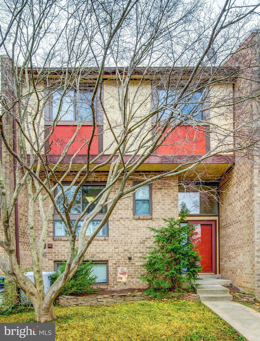 5 MINUTES TO HUNTINGTON METRO! This 3 level 3BR  spacious town home is nestled in a quiet community backing to a private nature preserve. Stunning wooded views from the many windows gives you  peaceful, sunlit living. Tip top shape!Eat in kitchen remodeled bathrooms neutral paint stone fireplace private balcony patio. Nature lover's retreat with the convenience of metro & public bus service.