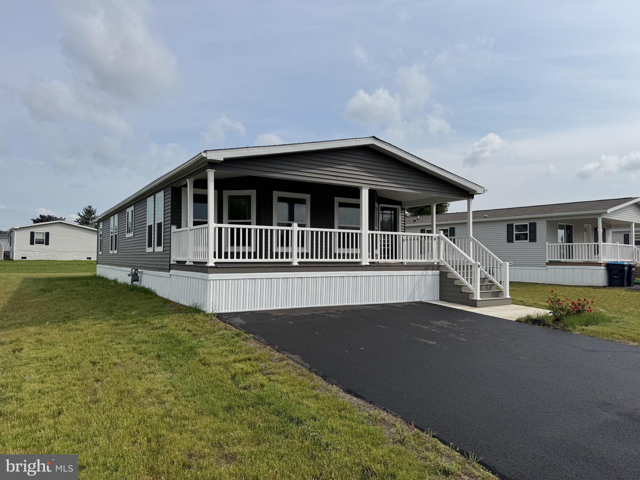 New construction, never-before-lived in, 1-floor appx. 1,524 sq. ft. 3 bed/2 bath manufactured home. Set amongst other all-new homes at Shadowstone Village, centrally-located one block from Main Street in Palmyra, PA. Shadowstone Village is a master-planned 55+ community with the warmth of a friendly neighborhood and close proximity to Hershey, Harrisburg, Lancaster and Reading without any of the big-city hustle or hassles. Walkable to salons/barbers, pizza shops and restaurants on Main Street, this home features open living spaces with a feature-packed kitchen, stainless steel appliances and both a front and rear covered sitting porch with low-maintenance composite decking and vinyl railings. All (underground) public utilities, natural gas heat, high-speed connectivity and a friendly, welcoming community convenient to the region's amenities make this home one to not miss.