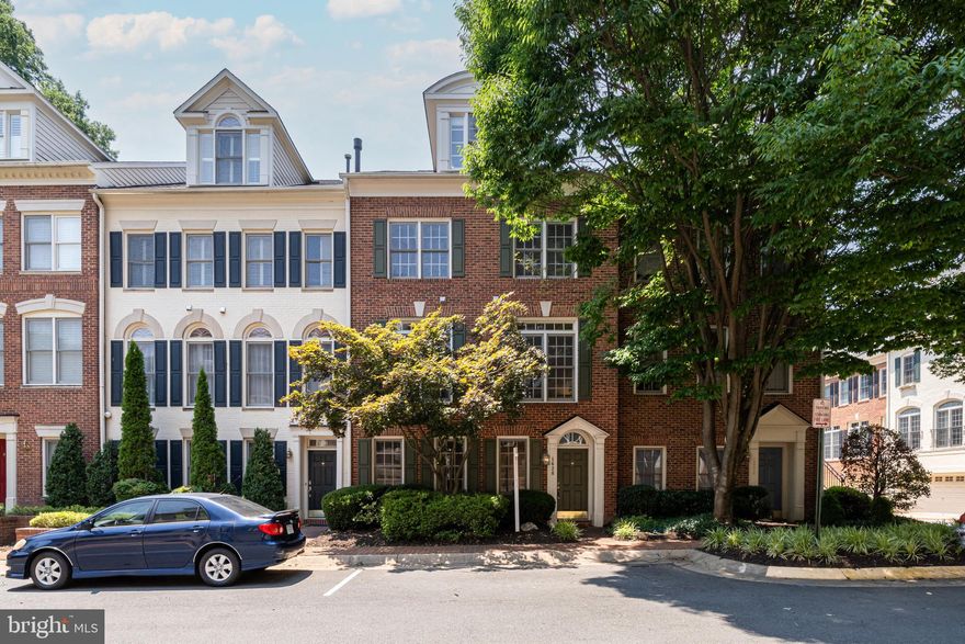 Nestled in a charming, picturesque neighborhood, this stunning four-level townhome is the epitome of elegance and modern convenience. Perfectly located just ½ miles from the McLean Metro station, this gem puts you minutes away from Tysons Corner, the Silver Line Metro, downtown McLean, Wolf Trap, and major thoroughfares.
Step inside to discover a freshly painted interior with gorgeous new hardwood flooring that flows seamlessly through an expansive, open floor plan. The main level boasts sun-drenched spaces, including a sophisticated dining room, inviting family room, and cozy morning area—each lined with huge windows and elegant French doors, creating an ambiance of warmth and light.
Ascend to the third floor, where the primary suite is nothing short of a sanctuary. Spanning an impressive 23 feet, this bedroom offers ample space for relaxation and rejuvenation. Revel in the opulent bathroom and revel in the abundant closet space. 
The fourth floor is your versatile top-floor retreat, perfect for study, play, or hosting guests. The ground floor is equally impressive with a spacious rec room, new flooring, and a 2-car garage, ensuring ample space for every need.