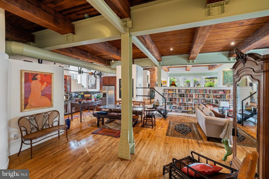 A Beaux Art Jewel on the Premier Block of Queen Village/Bella Vista

Once a bustling warehouse trading in imported breads, olives and oil, now an historic residence featuring four unique loft-style condominiums rarely offered for sale, the Coroneos Bros. building is a once-in-a-lifetime opportunity to own the best of the industrial age and modern urban living.

Steeped in character, rich in architectural detail, and spanning a full-floor, Unit 2 is an expansive 2,351 square-foot, two-bedroom, 2.5 bath home offering the openness of a loft and the refinements of an apartment, perfect for entertaining as well as thoughtfully appointed ease.

Step off a private elevator into a sweeping space swimming with natural light from all four exposures. Massive, exposed beams, oversized windows, soaring ceiling heights, original cast iron columns and brickwork are juxtaposed against a modern edge. An old pulley system above the kitchen has been preserved and repurposed as sculptural housing for modern track lighting. Tucked away in the former freight elevator an elegant study. A library the length of the great room. Beautiful hardwood floors run throughout.

Industrial steps float down to bedrooms, and up to a family room opening onto a sprawling private garden gorgeously landscaped and generous enough to seat eight dining al fresco. Truly an impossible-to-find oasis in the city.

Amenities:
Private Deeded Elevator
Deeded garage parking
Oversized deeded storage room
In-Unit Alarm System
Security in Garage and Common Areas
Meredith Catchment

Ideally situated in a neighborhood teeming with restaurants and coffee houses, adjacent to Society Hill, an easy stroll to Washington Square and Old City, and steps away from the Italian Market, and the urban cool of 4 th Street shopping, this is city living at its best.