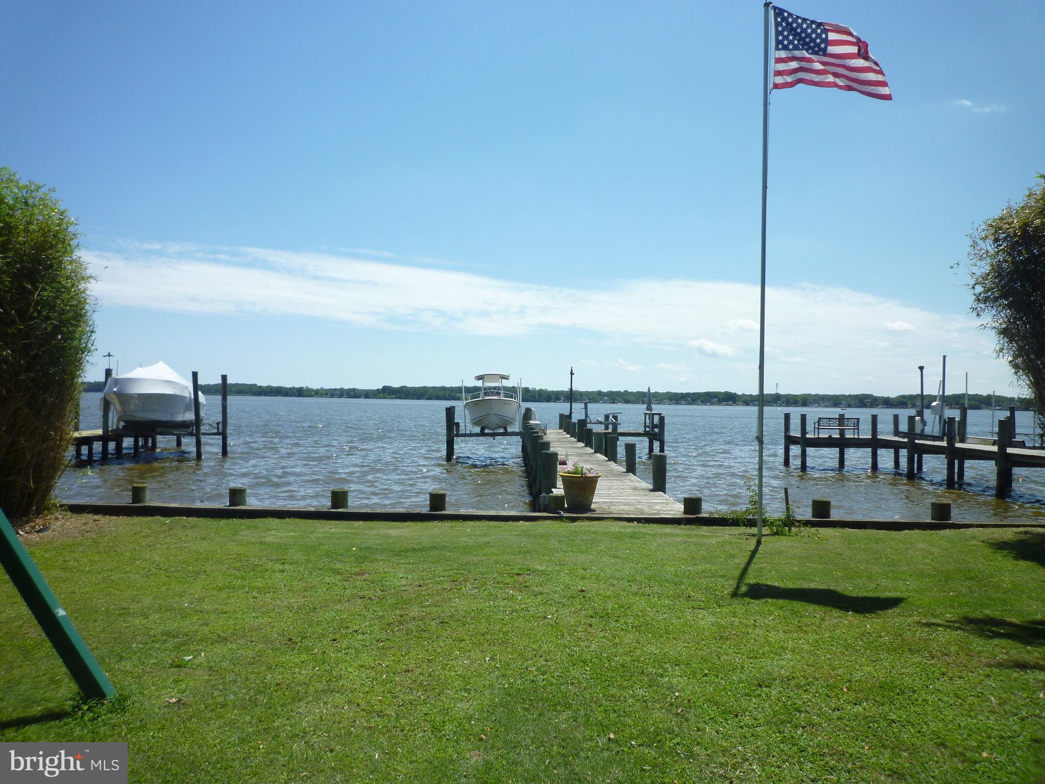 Bright and spacious, recently updated, WATERFRONT home on the Back River in highly desirable Wildwood Beach waterfront community. 1700-1800 sf (tax records incorrect - it does not reflect the back addition) updated bungalow with new roof, SS appliances, quartz countertops kitchen and bathroom, new insulated siding, new 100' pier w/boat slip and jet ski lift, 50 amp RV electrical hook up, 1 car garage, additional off street parking for 4-5 cars and the location to die for. Recent updates includes flooring, counters, appliances, paint, etc etc. This home is in a secluded community on a dead end and quiet street with almost no traffic and surrounded by 100s of acres of protected conservation woods, golf course and a local park and a museum. 3 min drive to the golf course and 5 min drive to the local public beach, recreation and sailing center. The water here is perfect for crabbing and fishing and hard sand bottom is ideal for swimming. And did I mentioned that the river has no speed limit so jet skies, speedboats and all kind of other fast boats are welcome! Also it is located within 10 minute drive to MARC Train Station and 3 minute boat ride to Hart-Miller Island boating recreation area. Public water and sewer with additional working well for your extra gardening needs.
To expand the 2nd floor and turn this property into 3 bedroom 2 bathroom on the 2nd floor and open floor plan on the 1st with powder room and kitchen should cost around $150,000. Staircase shall be moved to the outside and enclosed. That should bring property value to $850-900K.
Open House Every Day, Call for Times.