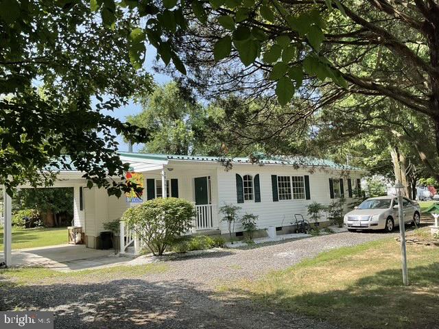 This home is located in the tucked-away community of Longview Beach at 36797 Ricardo Drive, Bushwood, Maryland, and is currently priced at $380,000.00. Sitting on 10,500 sf. is just under 1/4 acre. This recently updated home with great features for winter is the perfect location for the summer. A new metal roof with lighting rods was installed in 2019, including upgrading installation in the attic/ceiling and exterior walls. Home features a renovated eat-in kitchen with custom cabinets, a large kitchen counter area for breakfast, and new lighting that opens into the family room. The kitchen has access to the rear yard, and a covered carport or front porch area completes the living space.
This gem is awaiting a new owner to enjoy all the benefits of just a short a quiet haven for all nature lovers to sip your morning coffee and watch the wildlife that passes by. In the early morning, you can take a walk down less than half a mile to the shoreline for some early morning fishing, drop your boat at the pier, or just enjoy the view of the Potomac River.
The home is located
From Drive Time 1hour and 42 minutes from Washington, DC
From King George, Virginia, Drive time 45 Minutes
From Annapolis, MD, the Drive time is 1 hour and 48 minutes