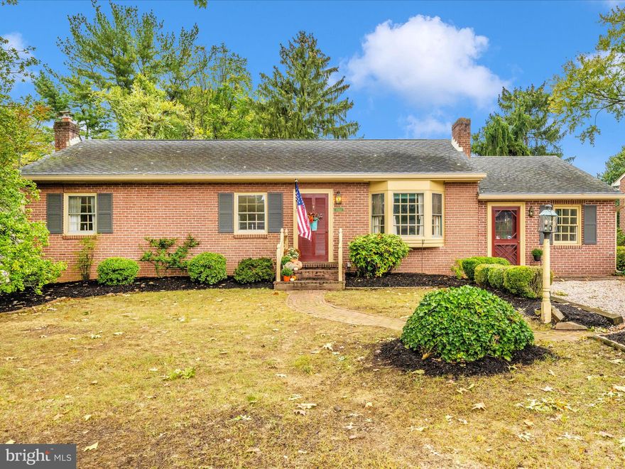 Welcome to this beautifully maintained ranch-style home, lovingly cared for by one family. From the moment you arrive, you’ll notice the quality and craftsmanship throughout, from the solid wood doors and hardwood floors to the charm in every detail.

Inside, the kitchen features cherry cabinets, and the home offers three bedrooms, one and a half baths, plus the potential for an additional finished room in the basement. The finished lower level is a highlight, complete with a cozy Franklin stove that’s vented upstairs—providing warmth and character, as well as practical comfort.

Year-round comfort is assured with central air, Mitsubishi electric heating and cooling, an oil heating system, and the wood stove. A standout feature is the sun porch, with its own HVAC system, a gas stove, and detachable glass panels with screens—creating the perfect spot to relax or entertain in every season.

The property has been thoughtfully updated with a new covered basement entrance, storm doors, new spouting, and a newer roof. Added conveniences include a water softener and hot water heater, while the home’s southern exposure fills the interior with beautiful natural light.

Outdoors, you’ll find a large backyard with mature landscaping and fencing, multiple brick features including a spacious patio and a handsome brick wall with railings on the front porch. The patio deck, with its screened-in section, extends your living space and makes entertaining effortless.

This property truly offers the best of both comfort and craftsmanship—a move-in ready rancher with timeless features, abundant upgrades, and unique spaces in a great location!