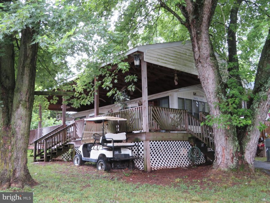 Are you ready to make this your vacation getaway??   Own it in as little as 3 weeks! Schedule your private showing today for this great camping lot in Riverbend RV Park. Features a 2 bedroom Mallard Coach Park model trailer, pavilion, covered deck, grill, table & chairs, deck swing shed and paved driveway. Potomac River access for boating, fishing & swimming. Yearly membership includes water, sewer, electric, trash and the park amenities such as pools, putt putt, basketball, tennis, fireworks, car show, carnival, restaurant, playground, ball field and much more. Call today for details to make this your summer getaway.  Motivated seller. Seller will look at all reasonable offers!!    (Direct TV  and Frontier Internet available with service install/hookup).