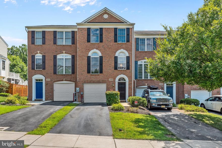 Fantastic Garage Townhome with dual master suites!  Large model with bump-outs on all 3 floors!  3 bedrooms, 3 full bathrooms, bonus office space, soaring ceilings and gleaming hardwood floors.  Spacious deck off gourmet kitchen with granite and stainless. Lower level  with fenced yard and garage access from foyer and rec room with possible 3rd bedroom.  Dual master suites on bedroom level.  2 walk in closets in main master with double doors to updated bath with dual vanities, soaking tub and tiled shower.