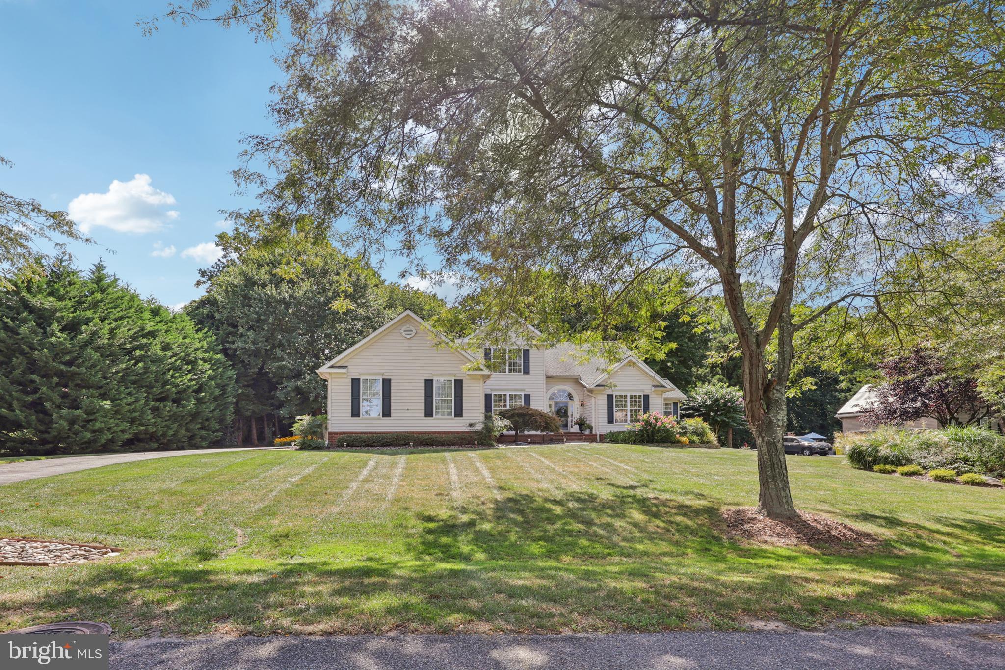 Experience the perfect blend of elegance and comfort in this impeccably maintained and beautifully updated 4-bedroom, 3.5-bath home. Thoughtfully designed for both everyday living and entertaining; it features an inviting open floor plan with soaring vaulted ceilings, oversized windows, dual loft overlooks, and a cozy gas fireplace.
The gourmet kitchen boasts upgraded countertops, a stylish backsplash, stainless steel appliances, and direct connection to the family room. A light-filled sunroom addition offers the ideal spot to unwind and enjoy the wooded views. The main-level primary suite is a private retreat with dual walk-in closets and a spa-inspired bath featuring heated floors and a heated towel rack. Completing the main level are a versatile office/formal living room, formal dining room, and a well-designed mudroom/laundry space.
Upstairs, you’ll find two spacious bedrooms, a full bath with dual vanity, and an open loft area ideal for reading, play, or office use. The lower level extends the living space with a private bedroom suite, recreation room, abundant storage, flexible hobby/fitness rooms, and a wide walkout to the backyard.
Outside you will find a beautifully landscaped yard backing to conservation land, where a paver patio provides the perfect setting for al fresco dining or evening gatherings. A spacious 2.5-car garage offers room for two vehicles plus storage or a golf cart.
Set in a serene location just minutes from downtown Annapolis and within easy reach of Washington, D.C., and Baltimore, this home combines privacy, modern updates, and timeless appeal—a true retreat for today’s lifestyle.