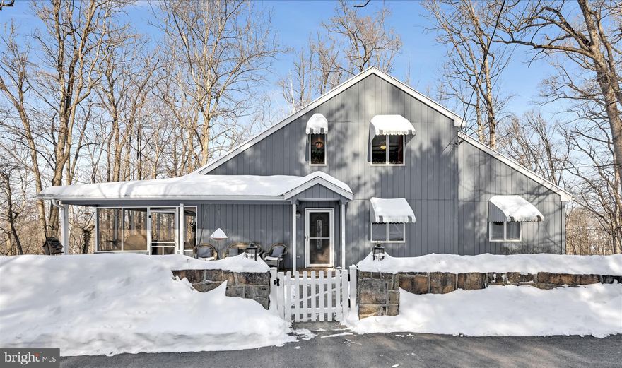 What. A. Spot.  Nestled in a wooded neighborhood with amazing views of the Susquehanna River, this adorable retreat feels like living in a tree house.  In addition to the setting, home has unique features including vaulted ceilings, newer sky lights, hardwood floors and first floor Primary Suite with walk-in closet, corner propane Fireplace and large attached Bathroom.  Enjoy the upcoming warmer weather from the large screened-in side porch, where you can watch the wildlife in the private wooded back yard.  The 2 upper floor Bedrooms are spacious and inviting and share a jack-and-jill style full Bathroom.  The eat-in Kitchen has large Pantry, hardwood floors, granite countertops and propane range.  For being in the woods, there is an amazing amount of windows and natural light.  Exposed Lower Level has Laundry and is unfinished with plenty of potential.  Attic space off front upstairs bedroom offers lovely additional walk-in storage.