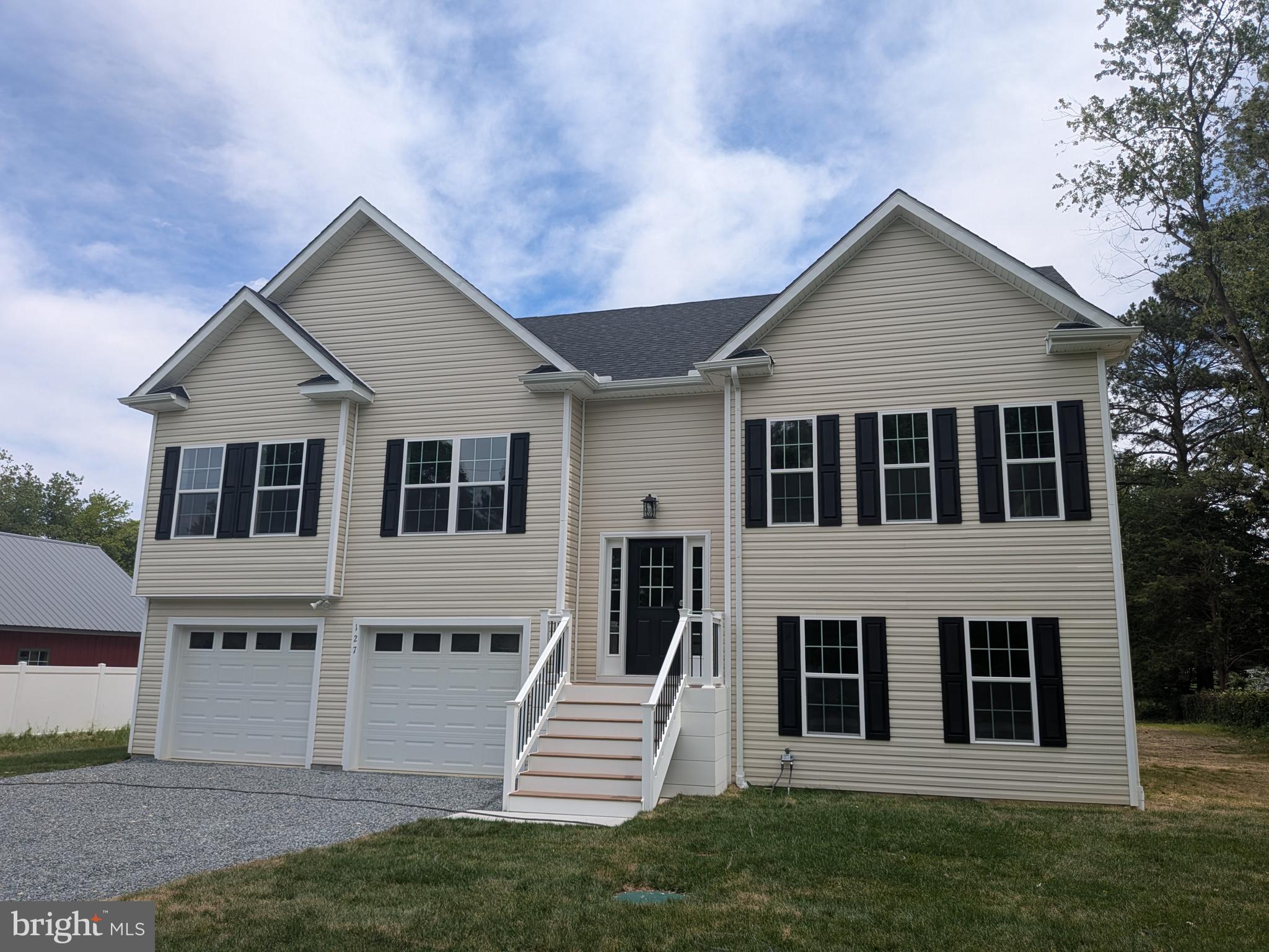 Discover your dream home in Stevensville, MD! This newly constructed 4-bedroom residence is designed for modern living and comfort. You'll love the smart design with durable and stylish vinyl plank flooring flowing throughout the bright upper level. The main floor offers a welcoming warmth with comfortable carpeting, creating distinct yet cohesive living spaces. Soaring vaulted ceilings enhance the open-concept layout, making every room feel light and airy. The generous living room provides a perfect spot for entertaining or simply unwinding. Prepare to be impressed by the gourmet kitchen, featuring abundant storage and gorgeous stone countertops that combine elegance with practicality. This home is truly move-in ready and waiting for your personal touch.