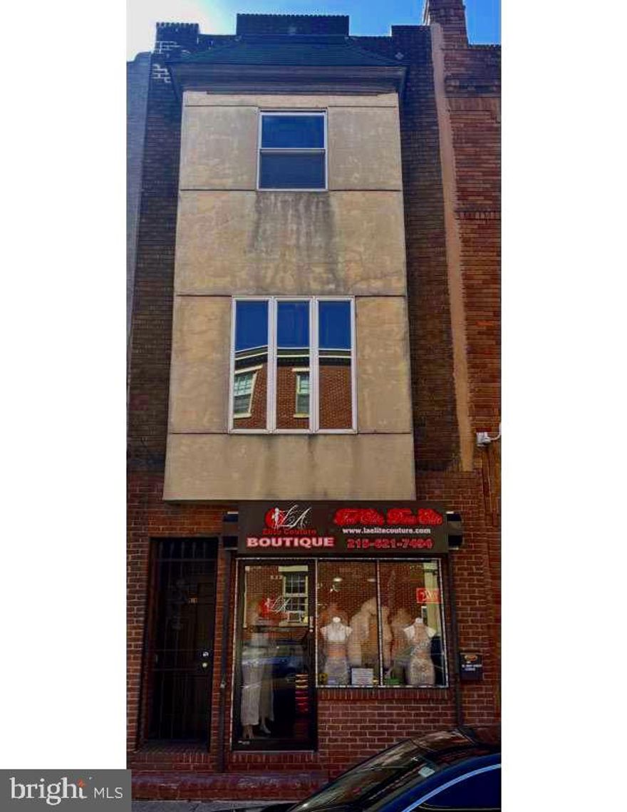 Prime mixed-use property located on iconic South Street, one of Philadelphia’s most vibrant commercial corridors. This income-producing building features a street-level retail storefront with excellent visibility, large display windows, and heavy pedestrian traffic, ideal for a variety of retail or office uses. Above the commercial space are two residential apartments offering comfortable layouts, bright living areas, functional kitchens, and generous natural light.
The residential units have separate access from the storefront, providing privacy and convenience for tenants. Situated in a dynamic neighborhood surrounded by popular restaurants, boutiques, entertainment venues, and public transportation, this property offers strong rental potential and long-term investment value.
Ideal opportunity for investors or owner-occupants seeking a live/work setup in a high-demand location.