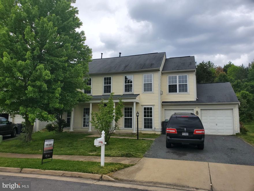 Freshly painted and floored home in Wayside Village.  Brand new Luxury Vinyl planks on the main level and brand new wall to wall carpeting on the stairs and throughout the bedrooms.  Large, open galley kitchen that leads into your dining room and living room.  The main level also boasts an additional living space and entry to your two car garage.  Upstairs has a master with a large walk-in closet and a master bathroom which includes a soaking tub, double vanity and a standing shower.  Also on the upper level are three good sized rooms with ample closet space and a hall bathroom with tub to share.  Large flat lot with lots of parking.