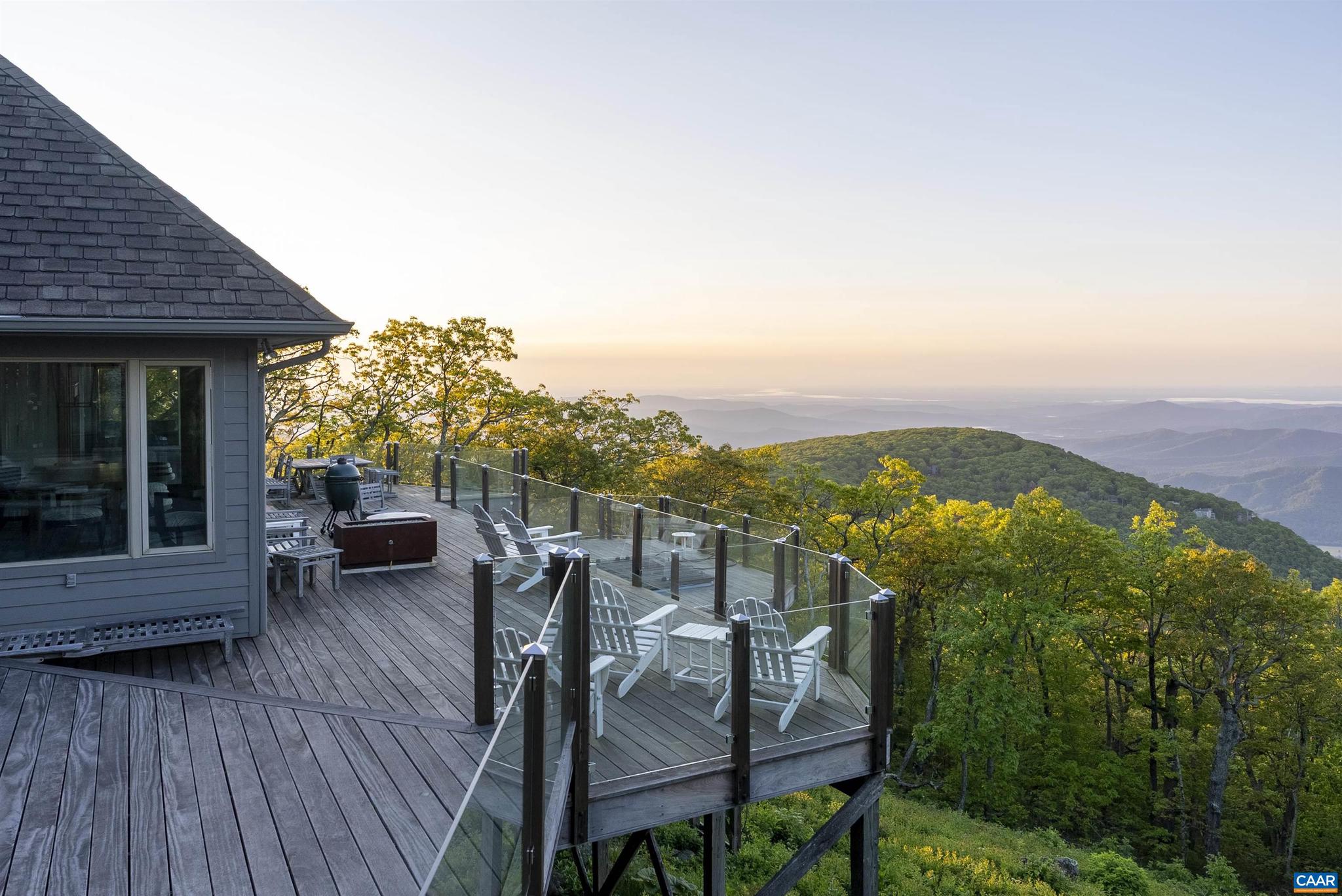 880 Devils Knob Loop is a stunning mountain estate where luxury and livability converge in the heart of Wintergreen Resort. This 6-bedroom, 5 full and 3 half-bath home blends timeless architecture with thoughtful updates, including Ipe hardwood decking, sleek glass railings, and top-tier Viking and Sub-Zero appliances. The vaulted great room, anchored by a dramatic stone fireplace, flows seamlessly into a chef?s kitchen and elegant dining area. An expansive deck with a built-in gas fire pit invites apr�s-ski gatherings and al fresco dining with panoramic views. A dedicated billiards room and spacious basement rec room offer ideal spaces for entertaining family and friends. The serene primary suite features a spa-inspired bath and forest vistas, while multiple guest suites ensure comfort for all. Enjoy all that Wintergreen offers with winter time skiing and summertime fun with pool, golf, tennis, lake activities and more. Perfectly positioned near hiking and the Blue Ridge Parkway, this exceptional home defines refined mountain living. Don?t miss the opportunity to own a piece of mountain paradise!,Granite Counter,Painted Cabinets,Fireplace in Great Room,Fireplace in Master Bedroom,Fireplace in Rec Room