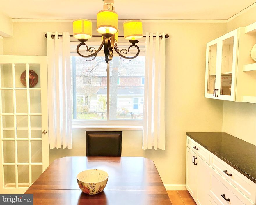 A RARE opportunity to break from the norm in this Cinderblock home situated in the lush green community of Old Greenbelt!  This 2-Level, Art Deco Townhome  has been tastefully updated throughout and well maintained.   Newly installed SS Kitchen appliance package (November 2021) along with Tile floors, Granite countertops, Shaker cabinets and Tile backsplash.  Separate Dining Rm replete with a Gorgeous 2-tier built-in Buffet & Cabinetry and decorative 4-scone Iron light fixture.  Spacious adjoining Living Rm boasts Brand New carpet (November 2021) and lovely natural light through Energy Efficient windows on either end.  On the Upper level are 3 generoulsy sized Bedrooms, Laminate Hardwood floors and an updated full bathroom featuring a stylish pedastal sink, stand up shower and tile floors.  Stay cool on those Hot Summer nights with an uncommon Mini-Split A/C system available on both levels.