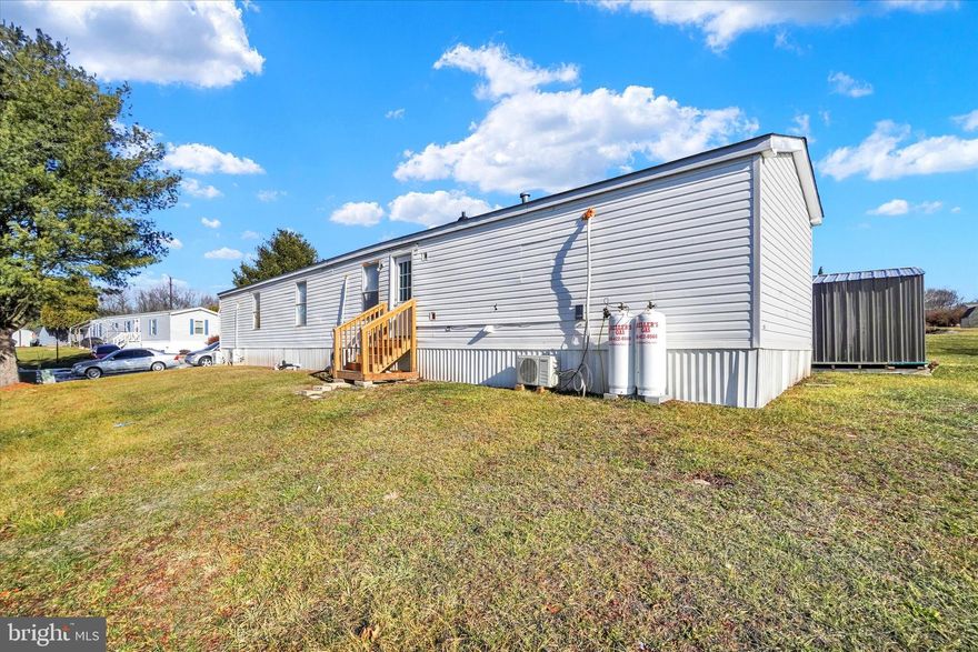 **Welcome to Your New Home!**  

Step into this nicely updated home with **980 square feet** of living space, this **single-wide home** boasts **three inviting bedrooms** and **two full bathrooms**, perfect for comfortable living.  

The exterior showcases **durable vinyl siding**, a **new roof (installed 11/2024)**, a **handy shed**, and a **ramp to the front door**, offering accessibility and additional storage. Inside, you'll find an array of upgrades, including:  
- **Luxury vinyl flooring throughout the home**, providing a seamless blend of durability and modern elegance.  
- A **completely remodeled kitchen** with sleek **stainless steel appliances** and white cabinetry.  
- **Updated bathrooms**, designed with modern finishes for your comfort.  
- **New windows** throughout, bringing in abundant natural light and energy efficiency.  
-  **Mini-split system**, delivering efficient heating and cooling for year-round comfort.  

Enjoy the convenience of **off-street parking** and a well-managed community with association fees covering **common area maintenance, sewer, snow removal, and trash services**—making life even easier.  

This home is not just a house; it’s a space to create lasting memories. Don’t miss the opportunity to own this move-in-ready gem!