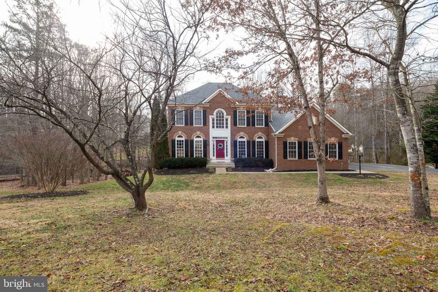 Beautiful spacious home on quiet cul-de-sac in South Wales.  This home offers newly updated  kitchen, bathrooms, carpet, flooring,  paint, roof & trex deck.  Wonderful home for entertaining family & friends!   Features on main level include  large entryway, home office, formal dining room, sitting room,  kitchen has granite countertops, large island, new appliances  &  opens to eating area & family room with gas fireplace, all  surrounded by large windows overlooking wooded back yard!  The upper level includes  4 spacious bedrooms with large closets &  full ceramic tile bathroom, owners suite has walk-in closet & ceramic tile bathroom. Lower level includes  additional family room with walk-out to patio, kitchenette,  2 additional rooms and a full bathroom & storage space.