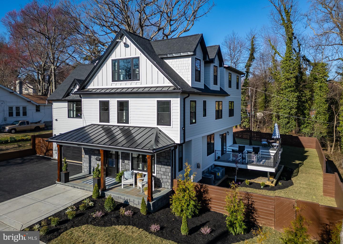 You have to see this new construction to believe it! This stunning seven-bedroom six bath stone colonial offers 5,200 square feet of spacious living. Situated in the desirable Beechwood neighborhood, this masterpiece includes many custom finishes. It’s also conveniently located just minutes from restaurants and shopping on the Main Line. Nestled amidst lush trees, the property features professional landscaping, mature plantings, and fully sodded grounds. The Jamie Harding Siding provides a modern aesthetic, and the Bluestone flag patio on the front porch offers an inviting introduction to this home's unique charm. The first floor features nine-foot ceilings, white oak plank flooring, Serena & Lily lighting, and specialty flush registers​. The living room's beauty is enhanced by a custom contemporary limestone fireplace, eight-inch custom baseboards, and oversized crown molding. The dining room features a custom coffered ceiling, The powder room has brick herringbone walls and flooring; The kitchen is a chef’s dream, boasting white shaker cabinets, a Calacutta quartz waterfall island, GE Café Series matte white appliances & quartz countertops. The open-concept connects the family room, which features a beautiful limestone fireplace, a custom wet bar, and sliding glass doors that open to your spectacular two-level Azek Vintage Collection Decking. The staircase is over four feet wide and features oak posts and railings. The primary bedroom is filled with beautiful natural sunlight and boasting stunning 13-foot ceilings with exposed beams, private outdoor patio and three closets, including a large walk-in closet. The ensuite is finished in pure white marble, inviting you to unwind in its soaking tub or wet shower. This home could accommodate two in-law suites if desired. The first suite features a bedroom with two large closets and a full bath with his and her sinks. There are also two more full bedrooms which share a Jack and Jill bath; On the third floor, you'll find a grand living room featuring large windows and a convenient dry bar. This floor also offers two bedrooms or a great spot for an office; On the lower level, discover a climate-controlled wine cellar, complete with custom wine racks and elegant Herringbone brick flooring. There's also a large tiled recreation room, two more rooms, one enclosed could be a bedroom or storage and a full tiled bath. This is a walk out and could serve as an au pair suite with its own private entrance. Custom fencing provides privacy to the backyard; the two-car garage is equipped for all your future needs, featuring a 220-volt outlet ready for electric vehicle charging. The driveway provides ample space for up to six additional cars, perfect for accommodating guests. This property is ideally located near two township parks, Suburban Square's dining and shopping, the Beechwood Brookline trolley, and the R5 to NY. You'll find it just outside Philadelphia and a quick twenty-minute drive to Philadelphia Airport. Located in the excellent Haverford Township School District, don't miss your chance to own a newly constructed, move-in-ready home. (Taxes TBD).