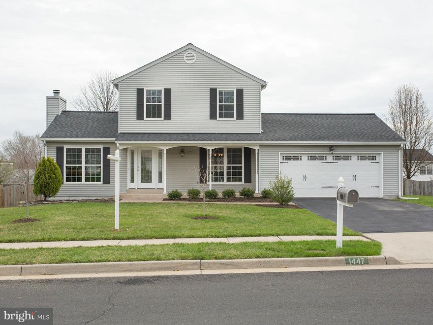 Delightful, sun-lit, & updated! Spacious kitchen with all the updates - cabinets, granite counters, & stainless steel appliances. Gleaming cherry hardwood floors on main level. LR with vaulted ceiling and wood-burning fireplace. Dining room opens onto 3-season screened porch. Large rec room on lower level + full bath. Large, fenced back yard. New roof, windows, & doors.