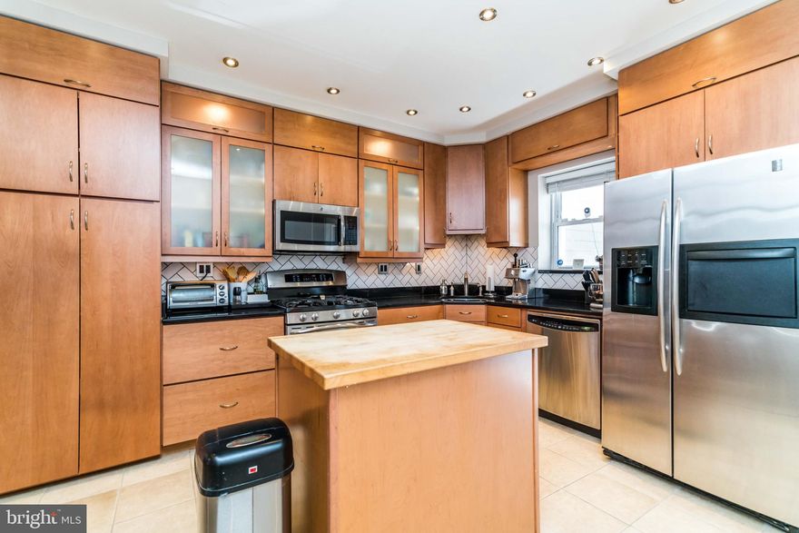 Take a peak at this CANTON GEM complete with a TRUE TWO-CAR parking pad! As you enter the home from the parking pad you are greeted by a gorgeous kitchen featuring a center island AND a breakfast bar. Tons of cabinets and quartz counter-top space perfect for cooking or entertaining! The living room and dining room are open-concept with great natural light and exposed brick! The main level also has a secure and convenient front-door vestibule and a BRAND NEW half bath! The upper level holds two generously sized bedrooms - and two stunning bathrooms (one full bath is COMPLETELY BRAND NEW)! Live now and rent later because this home is perfect for an investment down the road.  Additional amenities include a large unfinished basement perfect for extra storage and also has its own laundry area with full size washer and dryer.  From EXCELLENT location to TOTAL amenities, this home truly has it all. Seller recently repaired the roof as well. Schedule your private showing today as this home will not last long!