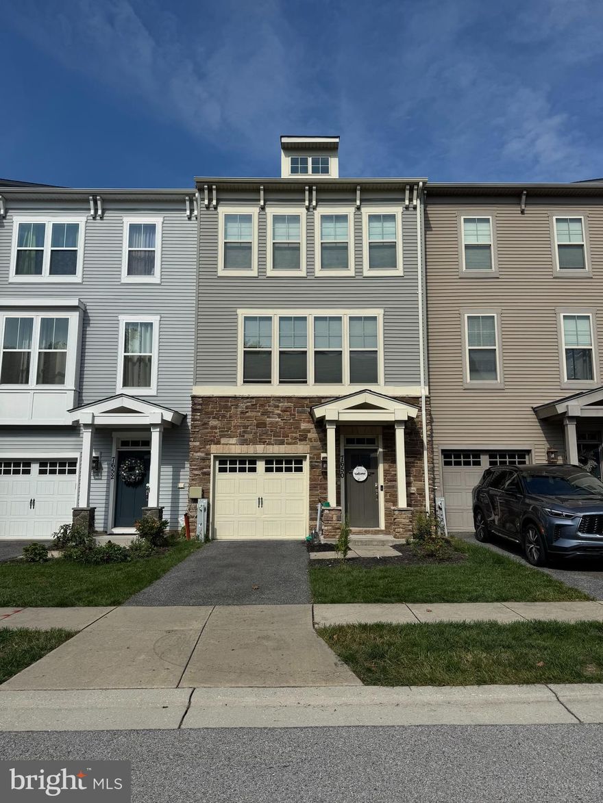 Discover this stunning townhome in the waterfront community of Tanyard Cove North! Backing to trees and community green space, this home offers the perfect blend of modern finishes, open-concept living, and resort-style amenities.

The entry level welcomes you with a spacious foyer, half bath, and large recreation room with recessed lighting and walkout access to the fenced yard and patio—perfect for play, entertaining, or relaxing outdoors. The main level features luxury vinyl plank flooring throughout, a bright dining area with access to a private deck, and a show-stopping gourmet kitchen with white cabinetry, granite countertops, tile backsplash, stainless steel appliances, and a large island with seating for four. The adjoining living room offers a comfortable space to gather, and there’s a convenient half bath on this level as well.

Upstairs, you’ll find three bedrooms, including a serene primary suite with a walk-in closet and spa-like bath complete with dual sinks and a walk-in tiled shower. Two additional bedrooms, a full hall bath, and laundry round out the top floor. The home also features a 1-car garage and driveway parking.

Tanyard Cove North offers exceptional community amenities including a pool, clubhouse, fitness center, dog park, playgrounds, pavilion, and scenic walking and biking trails. Ideally located near shopping, dining, and commuter routes with easy access to Baltimore, Annapolis, and Fort Meade. Schedule your showing today!