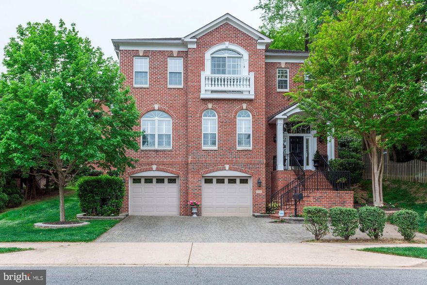 Stately, all brick 4 bedroom, 4 full and 1 half bath Colonial with over 5,000 sq feet of living space. Step  into the foyer that will take your breath away with an open living and dining room and a grand staircase to the upper level.  Gourmet kitchen opens to the family room with a gas fireplace and a gorgeous, private backyard with stone patio perfect for entertaining!  Upper level features a beautiful Master suite with a spa like bathroom and his and her closets, two additional bedrooms en suite and the laundry room.  The lower level has extra high ceilings with a recreation room, guest bedroom and full bath. The two car garage is very spacious and includes a large storage room for Costco runs and gift wrappers plus a tool/garden room.  Don't miss a great opportunity to own a house that has it all!