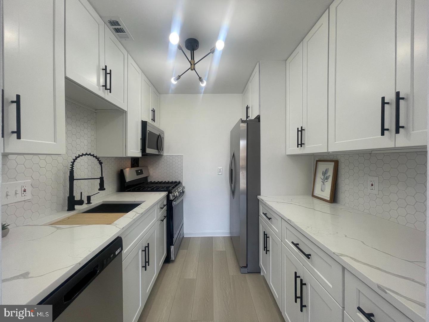 * CONDO FEE INCLUDES ALL UTILITIES *, The kitchen has undergone a stunning renovation, boasting new soft-close cabinets, a quartz countertop, a deep sink, and all-new shiny stainless-steel appliances. There is lots of NEW with this unit: waterproof LVP flooring, fresh paint, bathroom vanity with all the accessories, updated tile, NEW balcony blinds, New Ceiling Fan in the dining area, New shelves in the closets, New door lock, New outlets –Enjoy the perks of a spacious covered balcony with views overlooking the community pool, a handy storage room in the basement and laundry in the same building, ample natural light streaming through the large windows, and two walk-in closets. The community amenities include a swimming pool, playgrounds, a basketball court, and grills for outdoor gatherings. With its HOT prime location near transportation, the Dunn Loring metro, RT495, RT66, RT29, RT50, 14 miles to Amazon HQ, 15 miles to Washington DC, close to Tysons Corner, and INOVA Hospital. dining options, and the vibrant shopping scene at Mosaic District, Merrifield. FHA, VA loan approved