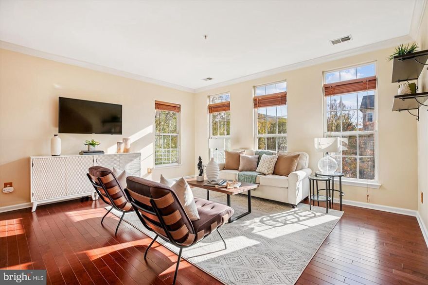 Opening directly to peaceful green space on desirable Cross Green, this updated end-unit townhome-style condominium offers over 2,200 sq ft of bright, light-filled living across three levels. The open main level features rich hardwood flooring, a 3-sided gas fireplace, ceiling fans, and spacious living and dining areas. The kitchen includes stainless steel appliances and granite countertops, with a breakfast area and balcony access. The primary suite offers a walk-in closet and a spa-style bath with a double vanity and soaking tub. Two additional bedrooms share a full bath, plus convenient upper-level laundry with a newer washer and dryer. Attached garage and ample unassigned community parking. Ideally located minutes from Lakelands’ shops, dining, parks, and trails. A premium home with comfort, convenience, and strong seasonal rental demand.