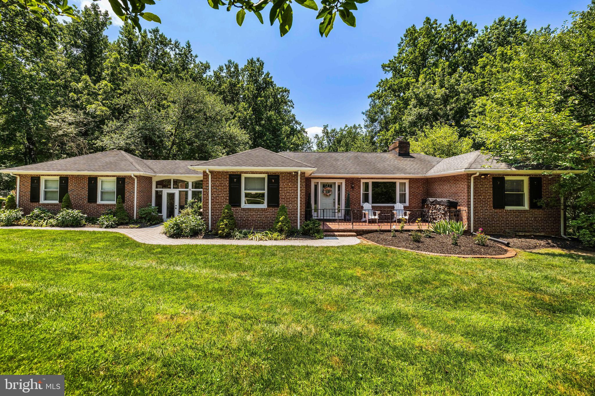 Beautifully updated and seamlessly expanded 4 Bedroom, 3 Bath all brick home. Tremendous open floorplan, perfect for large scale entertaining or modern family living. Living Room with large windows on 2 sides flows to a banquet-size Dining Room with fireplace and open flow to the updated Kitchen. The Kitchen, total 2014 renovation, includes a breakfast bar, quartz counters, subway tile backsplashes and stainless steel appliances. Enjoy breakfast, lunch and dinner or just relaxing in the Sunroom. The Primary Bedroom features a 2019 Bath with soaking tub, matching vanities, glass enclosed shower stall and adjoining custom fitted Dressing Room with Laundry. 3 additional Bedrooms and updated (2022) Hall Bath complete the main level. The Lower Level, renovated in 2020, includes luxury vinyl plank flooring, large Family Room with fireplace and custom fitted study/office area, Exercise Room and full Bath.