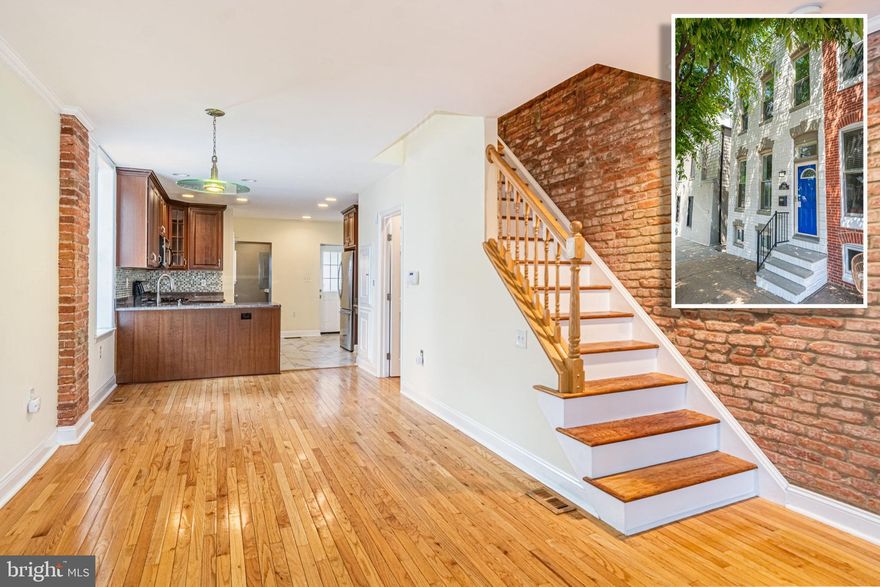 BEAUTIFULLY DESIGNED END OF GROUP CANTON ROWHOME WITH OVER 1,200 SQ. FT. OF LIVING SPACE AND A ROOFTOP DECK!  Features include gleaming hardwood floors throughout, a spacious living room and dining area with exposed brick, crown molding, and fireplace, a Chef's kitchen with granite counters & ss appliances, main level half bath and laundry, a dumbwaiter from the main level to the rooftop deck level, upper level with 2 generously sized bedrooms and 1.5 baths including a dual entry bath, an unfinished basement that's perfect for storage, desirable hall access to the rooftop deck with sweeping views, a rear patio with a privacy fence, and a new roof!  All this and located steps to Canton Square, Safeway, and Canton waterfront!