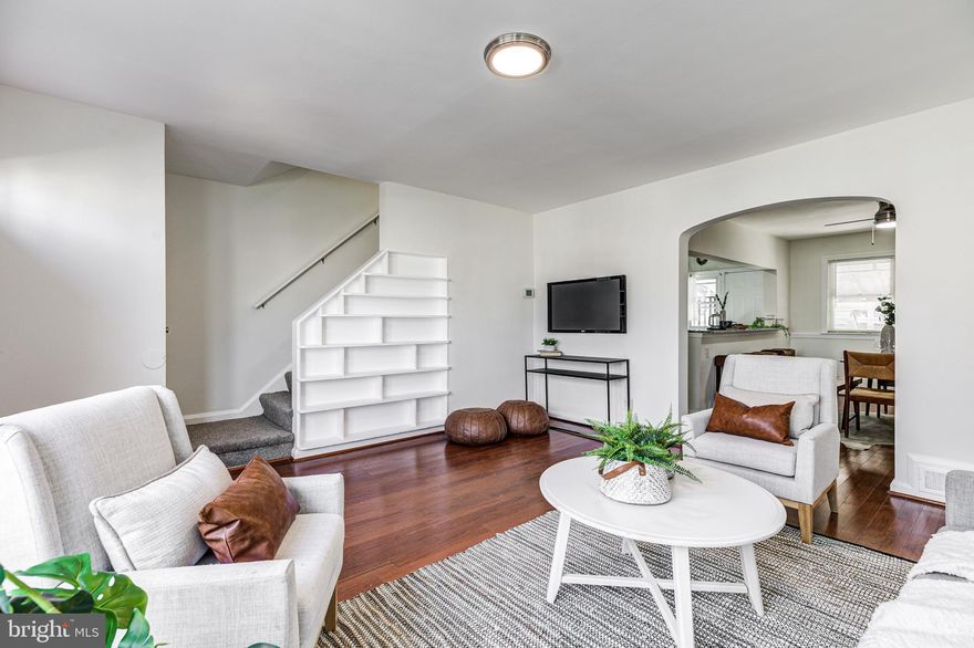 Meticulously kept Loch Raven beauty with 3BR/2BA, finished basement, covered rear porch and easy driveway parking! Enter into your light-filled living room to find gorgeous hardwood floors and a custom built-in along the stairs. Pass through the classic archway to find an ample dining space and a huge breakfast bar. The kitchen includes wonderful stainless steel appliances, upgraded granite countertops, new spill-proof vinyl flooring, and offers entry to the rear covered patio and private parking. The upper level includes 3 spacious bedrooms and a custom tiled full bathroom with a shower/tub combo. The bathroom includes a linen closet for storage and offers access to the attic space. The large finished basement provides another family room/flex space, LG stackable washer dryer, and a second full bath with custom tile surround. The rear yard offers a storage shed, a concrete driveway, and is fully fenced with a gate. This beautiful home includes all new carpet and a fresh coat of paint throughout. Located in the Loch Raven neighborhood, you have convenient access to Towson, downtown Baltimore, and many local green spaces. Don't miss this gem!