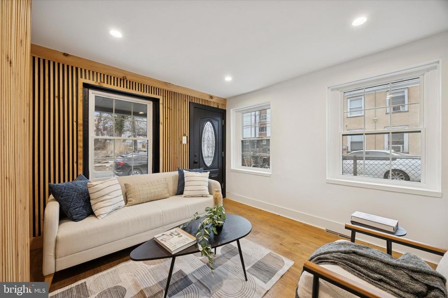 Recently renovated 2-bedroom, 1-bath twin home in the desirable Norris Square neighborhood. This move -in ready property features brand new windows, engineered hardwood flooring, and modern finishes throughout. The bright and inviting living area offers stylish wood accent walls, dedicated dining space, and an updated kitchen with white shaker cabinets and stainless-steel appliances. Upstairs offers two comfortable bedrooms and a fully updated bathroom. 
Additional features include front patio, modern lighting throughout, and thoughtful design touches that give this home a warm and contemporary feel.  Conveniently located close to public transportation, shopping and dining. Perfect for first-time buyers or investors seeking a move-in ready property in a growing area.