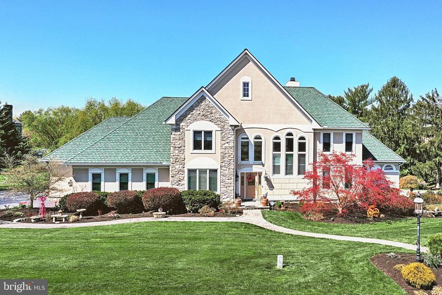 Absolutely stunning custom contemporary with upgrades galore at every turn.  Architectural detail and appeal w/cathedral ceilings, large open foyer w/marble floor w/inlaid wood design, great room w/cathedral ceiling and built-ins. Formal dining room and stunning gourmet kitchen w/two ovens, cooktop, Corian counters, breakfast area, island and pantry. Primary bedroom suite on the first level offers trey ceiling, wood floor, walk in closet with built in dressers and shelving, Jacuzzi tub in primary bath, along with a walk in shower. First floor laundry, office area and large enclosed deck with heat and AC, ceiling fans and laminate flooring and built ins. Second level offers three spacious bedrooms, with two bedrooms and Jack n Jill bathroom. Second floor balcony overlooks the great room! Basement is fully finished with carpet, gas fireplace, half bath and walkout to covered stone patio.  There is a heated shed, two Koi ponds and fountain at the base of the staircase leading to the upper deck.  Three car garage and plenty of parking area. Truly an exceptional home with a family friendly floor plan and the ability to entertain with ease!