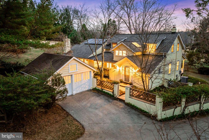 Look no further! This charming, beautifully maintained and sun-filled 1900's farmhouse has it all, including easy first floor living and is set on a breathtaking 1.8 acre lot, adjacent to conservancy grounds in highly sought after Devon.  Features include a bright 2-story entrance foyer, traditional living and dining rooms with deep set newer windows, restored oak floors, original fireplace, built-ins, millwork and moldings, a timeless Waterbury kitchen with distressed cherry cabinets, soapstone countertops, Sub-Zero and Thermador appliances opening up to a spacious breakfast room and integrated family room with soaring ceilings, lots of windows and a second gas fireplace, convenient powder room, spacious first floor primary suite with office/ sitting area, full bathroom, walk-in closets and a private sunroom. Front and back staircases both lead up to the second floor which offers the flexibility of 3-4 additional bedrooms/ office spaces, 2 additional updated, white-tiled baths, bright newer windows in each room and neutral decor throughout. Additional improvements include a new roof in 2019, expansive flagstone patio with private views, specimen plantings and gardens, updated systems which include the integration of energy efficient solar power with back-up capacity, freshly painted exterior and more, This very special property offers an oasis-like setting while being just minutes away from renowned TE public and renowned private schools, endless recreational opportunities, all major commuting routes, trains, shopping, restaurants, Center City Philadelphia and more. A real treasure.