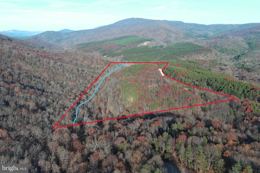 NEED TO BE IN THE COUNTRY BUT NEED CONVENIENT LOCATION?.....20 WOODED ACRES ONLY 3/4 OF A MILE OFF 4 LANE SUPER HIGHWAY BEHIND SECURE GATE IN THE PRETIGIOUS 10,000 ACRE MOUNTAIN COMMUNITY OF ASHTON WOODS. HUGE FLAT CLEARED BUILDING SITE WITH CIRCULAR DRIVEWAY AND WATER WELL(needs pump system) ALREADY INSTALLED, HARDWOODS & PINES WITH SMALL MOUNTAIN STREAM AND TRAILS....FIBER INTERNET AVAILABLE, POWER & PERKED.....HUNT, SHOOT, CAMP.....BUILD YOUR WEEKEND GETAWAY OR FULL TIME HOME......ONLY 5 MINUTES FROM MOOREFIELD.....WAL MART, SCHOOLS, RESTAURANTS, THEATER.....40 MINUTES FROM SKI RESORTS....10 MINUTES FROM MULTIPLE ACCESS POINTS ON THE SOUTH BRANCH OF THE POTOMAC RIVER......30 MINUTES FROM WORLD CLASS TROUT STREAMS AND 10'S OF THOUSANDS OF ACRES OF THE GEORGE WASHINGTON NATIONAL FOREST.....COMMUNITY OFFERS PRIVATE ACCESS POINT TO NATHANIEL MOUNTAIN WILDLIFE MANAGEMENT AREA, 10,000 ACRES OF PUBLIC HUNTING & HIKING......ALL OF THIS WITHIN AN EASY 2 HOUR DRIVE FROM NORTHERN VIRGINIA......EASY PRETTY DRIVE.....RIDE YOUR HARLEY OR FERRARI TO THIS LAND. 25k WORTH OF INFRASTRUCTURE ALREADY DONE! FOR ANOTHER 15K YOU COULD BE FULLY FUNCTIONAL WITH SEPTIC, ELECTRIC AND A PUMP SYSTEM FOR THE WELL....IT'S ALMOST THERE......IN JUST A FEW DAYS AND A FEW DOLLARS YOU COULD HAVE ALL UTILITIES IN PLACE AND BE READY TO BREAK GROUND OR HAVE A FULLY FUNCTIONAL SITE FOR YOUR RV! JUST HIT THE EASY BUTTON AND BUY IT....THIS ONE'S A NO BRAINER!