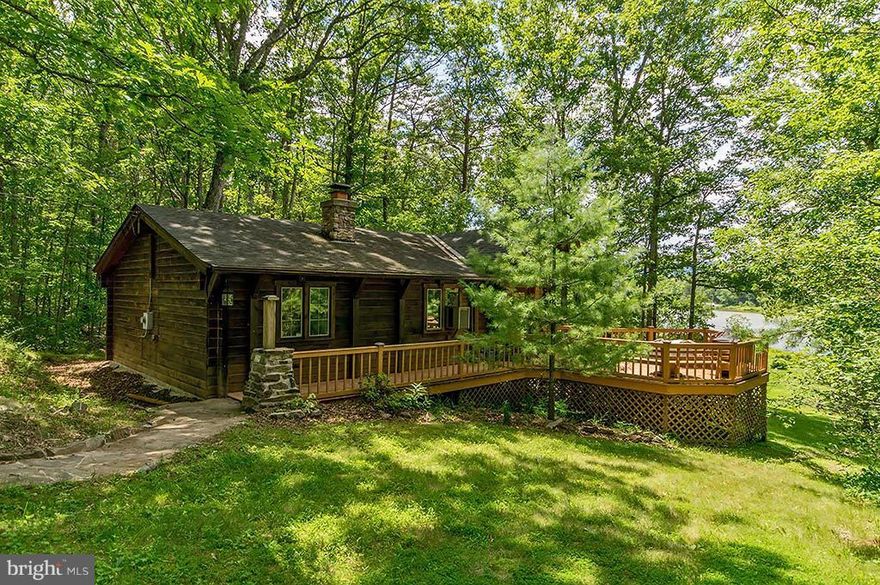 Authentic Log and Timber Cabin overlooking 48 acre Lake Ferndale. 5 acre lot offers over 270' of waterfront property. From your pier go fishing, swimming, launch your canoe - Cabin offers 2br, 1ba, open kitchen, living rm with beautiful stone FP and vaulted beam ceilings. Nice deck for outdoor BBQs. Screened porch to enjoy the view! Included are two adjoining 5 acre parcels for total of 15 Acres.