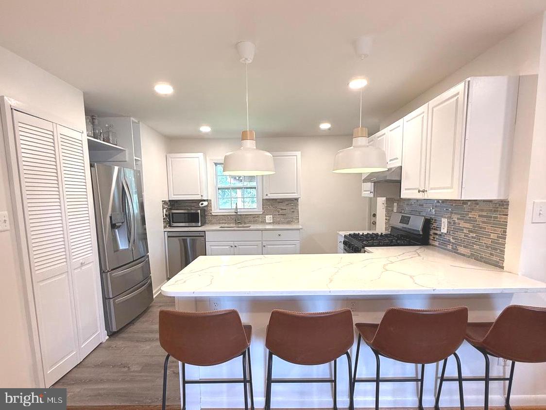 With improved price, this house is a real Gem!
Totally Renovated and Just Minutes from DC!
Welcome to 8107 Phelps Place — a beautifully renovated raised rambler ideally located in the heart of District Heights, MD, just about 7 miles (a few stoplights) from the vibrant energy of Washington, DC.
Step inside and fall in love with the open, airy layout featuring gleaming hardwood floors throughout the entire main level. The newly renovated kitchen is a showstopper, boasting a stylish peninsula overlooking the bright and welcoming living room — perfect for gatherings and casual nights in. Retreat to the renovated primary bath, thoughtfully designed with today’s modern finishes. Plus, enjoy the convenience of a dedicated washer and dryer on the main level, adding everyday ease to your lifestyle.
Downstairs, the newly finished lower level provides incredible flexibility with 2 bedrooms, 1 full bath, a full kitchen, and its own private washer and dryer — ideal for a rental unit, guest suite, or multi-generational living. Best of all, it's currently rented to a quiet, respectful tenant, offering instant income potential.
Outside, enjoy endless possibilities on the covered rear porch, overlooking an extra-large, fully fenced backyard with a cozy fire pit and a handy storage shed — your perfect outdoor escape.
With easy access to shopping, dining, the Capital Beltway, and multiple public transportation options, this move-in ready home is the perfect blend of comfort, style, and convenience.
So much to love — come see it for yourself!