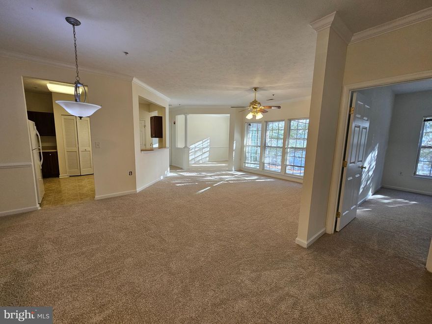 New Carpet & Freshly painted! 2 bed & 2 bath condo in Piney Orchard. Seperate Dining room, Den & Family rooms. Secured Building & Gated community. Exterior storage & Patio. Backs to trees/Privacy. Community offers Indoor/Outdoor Pools, tot lots, Gym, local shopping, nature/walking paths, Ice Rink, Minutes to Ft Meade/NSA/MARC Train station. Unit has washer/dryer.